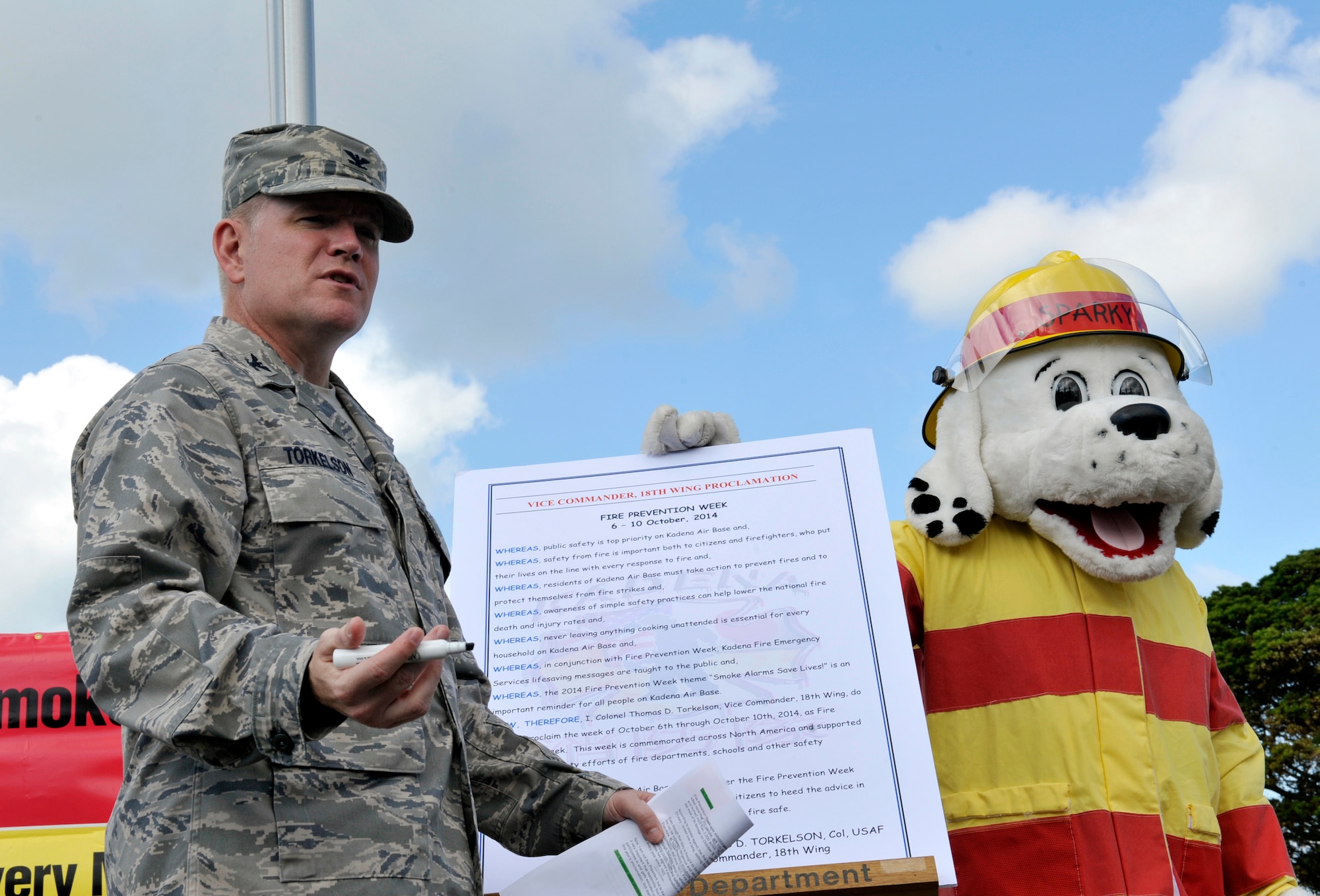 U.S. Air Force Col. Thomas Torkelson, 18th Wing vice commander, explains Fire Prevention Week to Stearly Heights Elementary students on Kadena Air Base, Japan, Oct. 15, 2014. Fire Prevention Week is from Oct. 5-11, and is focused on promoting fire safety and prevention. (U.S. Air Force photo by Naoto Anazawa/Released)