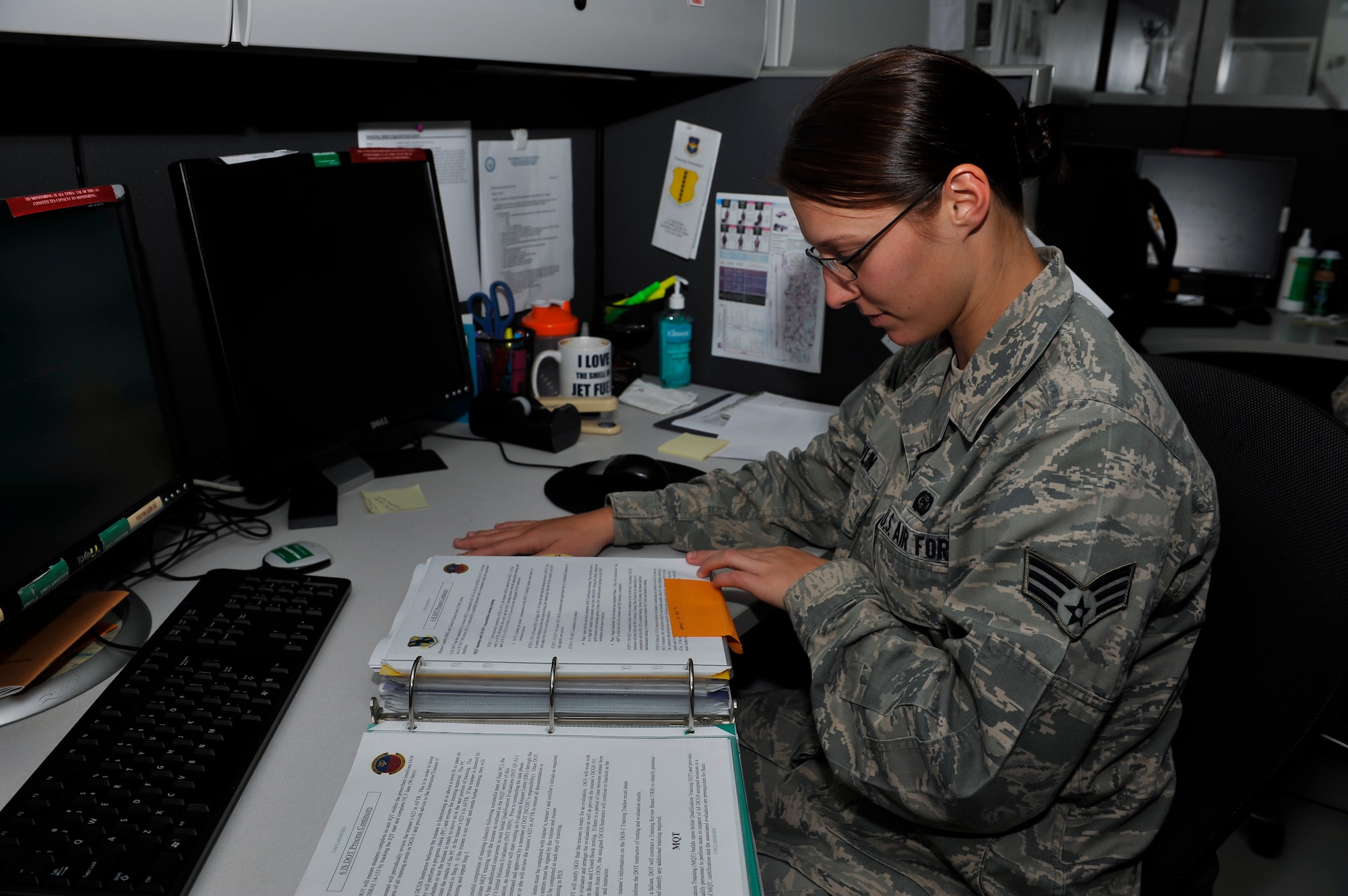 Senior Airman Amber Devlin, 694th Intelligence, Surveillance and Reconnaissance Group program manager, updates the training continuity binder Oct. 15, 2014, on Osan Air Base, Republic of Korea. Devlin was selected to be a part of the 15-player roster on the Air Force’s Women’s softball team. (U.S. Air Force photo by Senior Airman David Owsianka)