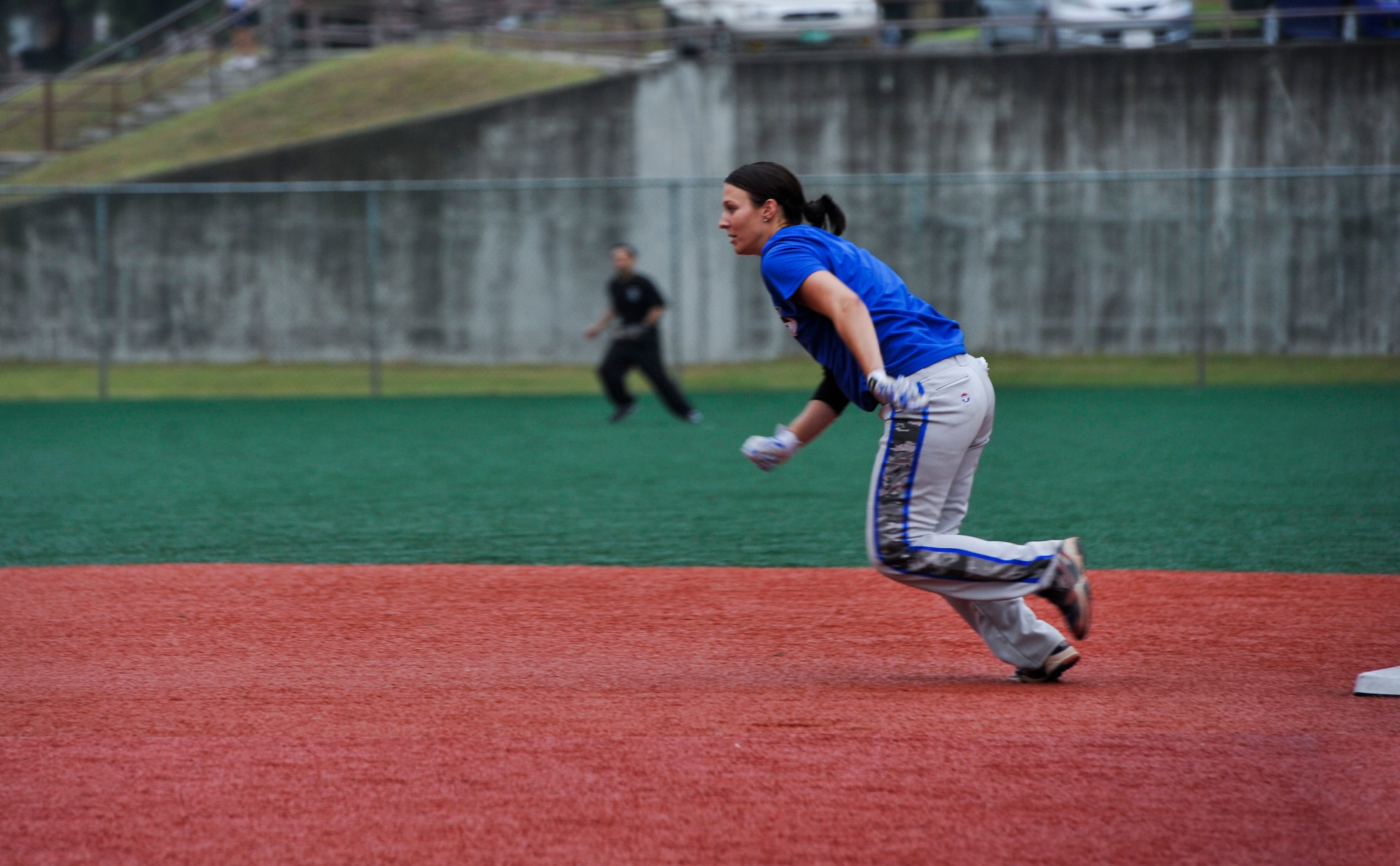 Senior Airman Amber Devlin, 694th Intelligence, Surveillance and Reconnaissance Group program manager, runs to third base during the fifth inning of a softball game against the 3rd Battlefield Coordination Detachment Sept. 29, 2014, on Osan Air Base, Republic of Korea. Devlin was selected to be a part of the 15-player roster on the Air Force’s Women’s softball team. (U.S. Air Force photo by Senior Airman David Owsianka)