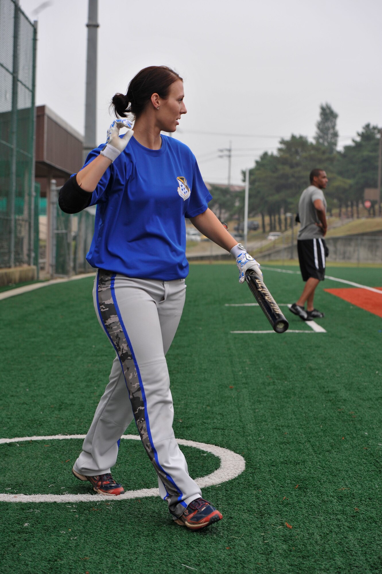 Senior Airman Amber Devlin, 694th Intelligence, Surveillance and Reconnaissance Group program manager, walks to the plate during the fourth inning of a softball game against the 3rd Battlefield Coordination Detachment Sept. 29, 2014, on Osan Air Base, Republic of Korea. Devlin was selected to be a part of the 15-player roster on the Air Force’s Women’s softball team. (U.S. Air Force photo by Senior Airman David Owsianka)