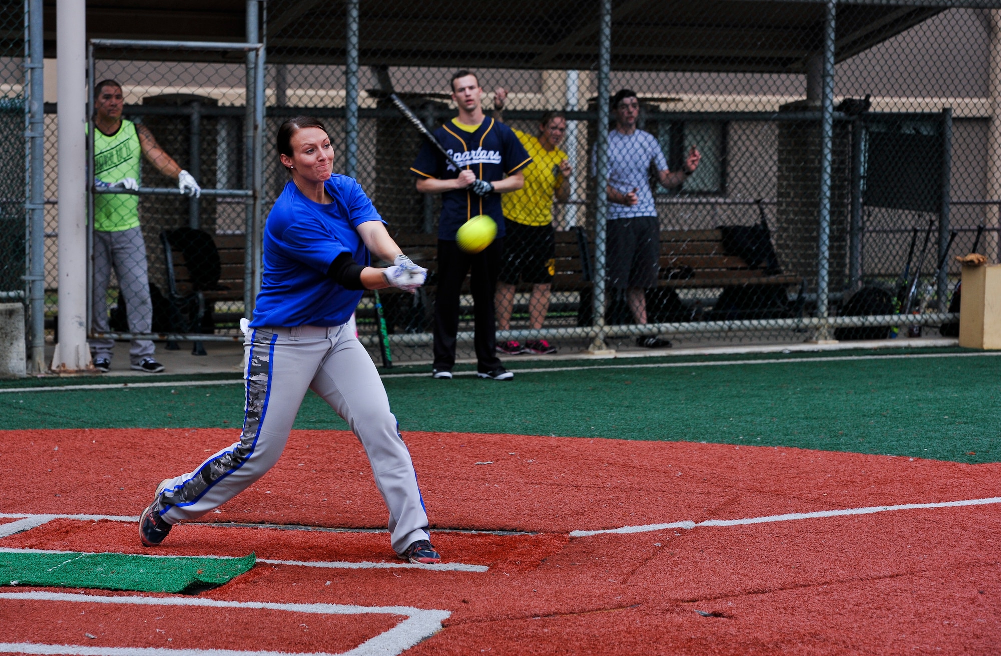 Senior Airman Amber Devlin, 694th Intelligence, Surveillance and Reconnaissance Group program manager, hits the ball into the outfield during the fifth inning of a softball game against the 3rd Battlefield Coordination Detachment Sept. 29, 2014, on Osan Air Base, Republic of Korea. Devlin was selected to be a part of the 15-player roster on the Air Force’s Women’s softball team. (U.S. Air Force photo by Senior Airman David Owsianka)