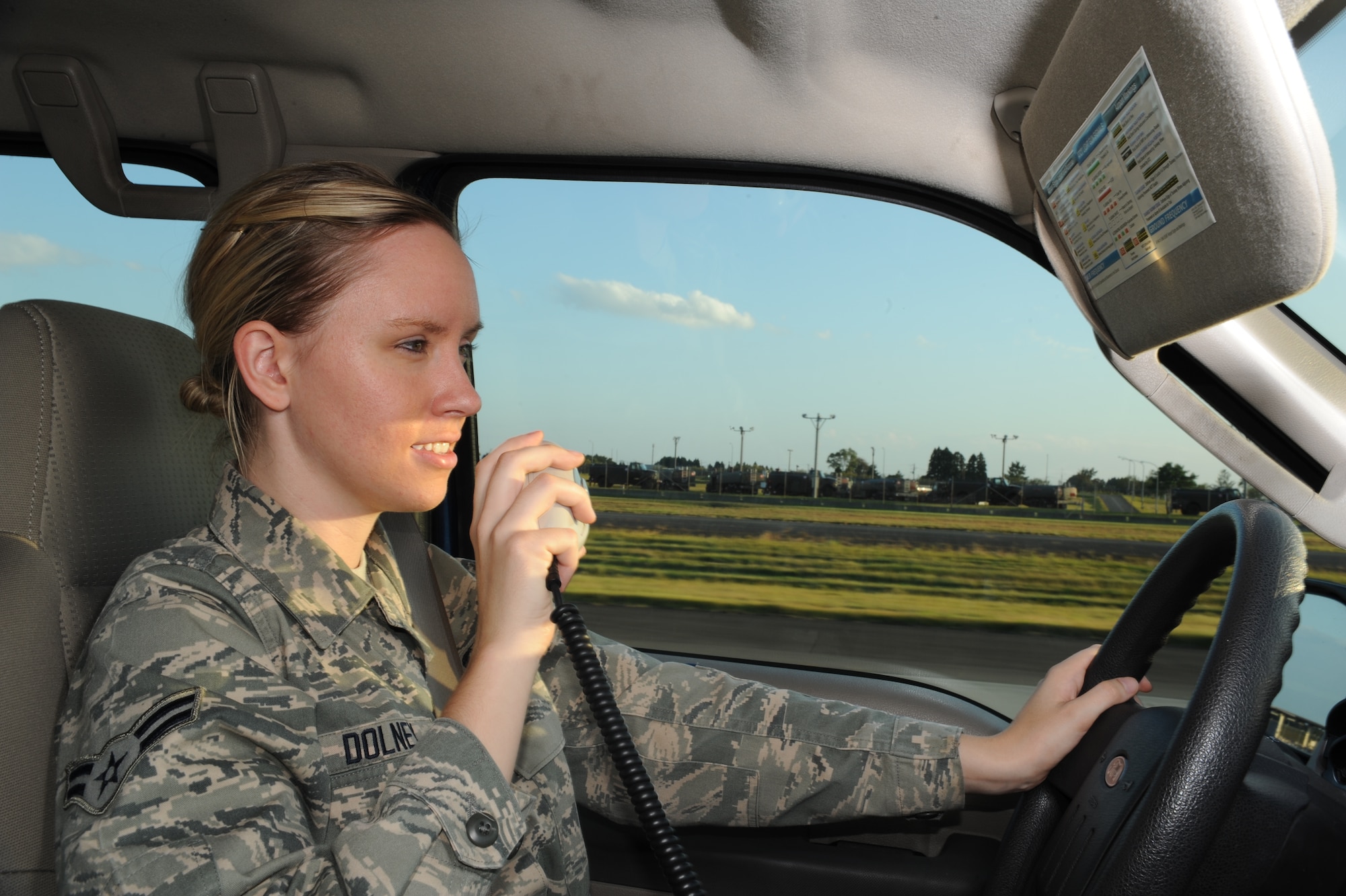 Airman 1st Class Brittany E. Dolney, 35th Operations Support Squadron airfield management shift lead, conducts a daily check of the airfield at Misawa Air Base, Japan, Oct. 3, 2014. Part of her job includes creating restrictions on the airfield and determining braking actions on the runway to ensure that Misawa AB’s aircraft and passengers are safe while on the airfield.