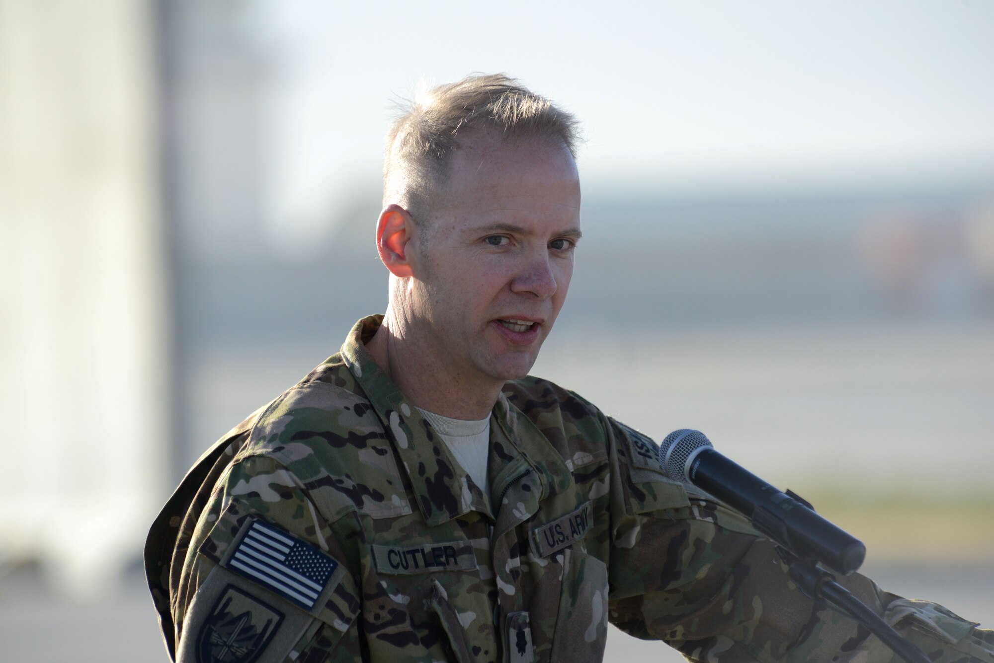U.S. Army Lt. Col Christopher S. Cutler, commander 306th Military Intelligence Battalion, Joint Task Force Odin, makes closing remarks during the MC-12W transition of authority ceremony at Bagram Airfield, Afghanistan Oct. 1, 2014. The 4 ERS inactivated and Joint Task Force Thor is now the lead for the MC-12W mission. (U.S. Air Force photo by Master Sgt. Cohen A. Young/Released)