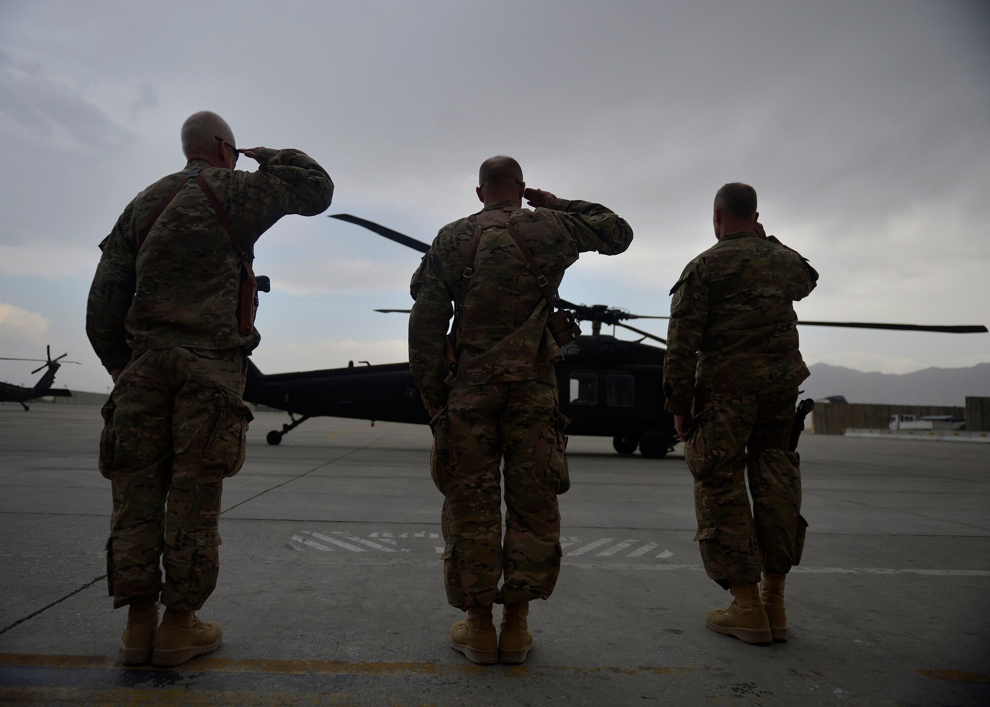 Leadership with the 455th Air Expeditionary Wing salute U.S. Army Gen. John Campbell, International Security Assistance Force and United States Forces- Afghanistan commander during his arrival to Bagram Airfield, Afghanistan Oct. 12, 2014.  Campbell spoke with Airmen across the wing during his visit.  (U.S. Air Force photo by Staff Sgt. Evelyn Chavez/Released)