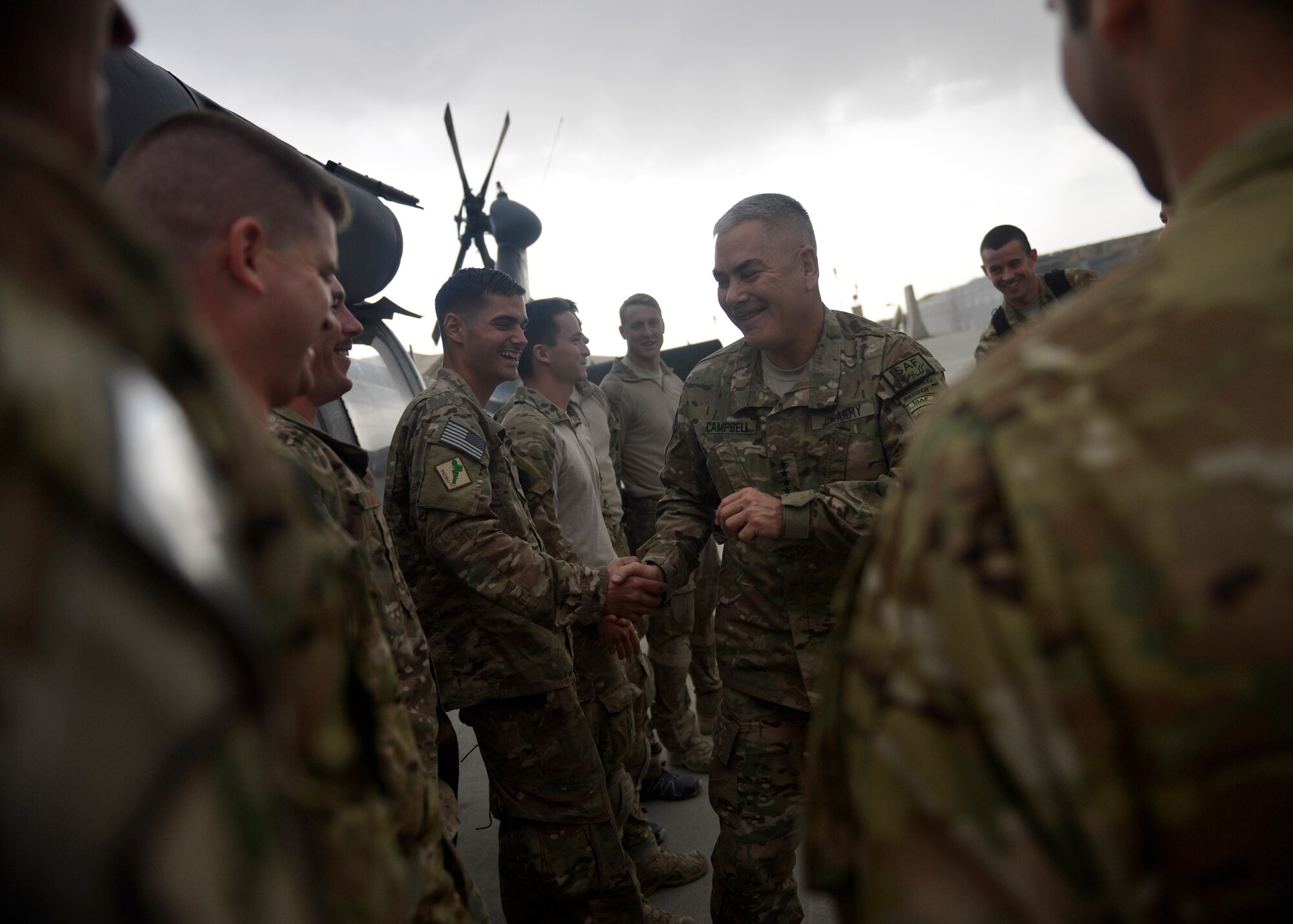 U.S. Air Force Airmen with the 83rd Expeditionary Rescue Squadron shake hands with U.S. Army Gen. John Campbell, International Security Assistance Force and United States Forces- Afghanistan commander at Bagram Airfield, Afghanistan Oct. 12, 2014.  Campbell visited several units and thanked Airmen for their service.  (U.S. Air Force photo by Staff Sgt. Evelyn Chavez/Released)
