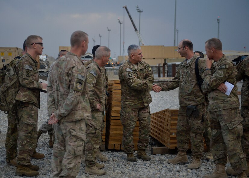 U.S. Army Gen. John Campbell, International Security Assistance Force and United States Forces- Afghanistan commander shakes hands with leadership from the 455th Expeditionary Aerial Port Squadron at Bagram Airfield, Afghanistan Oct. 12, 2014.  Campbell visited several units and thanked Airmen for their service.  (U.S. Air Force photo by Staff Sgt. Evelyn Chavez/Released)