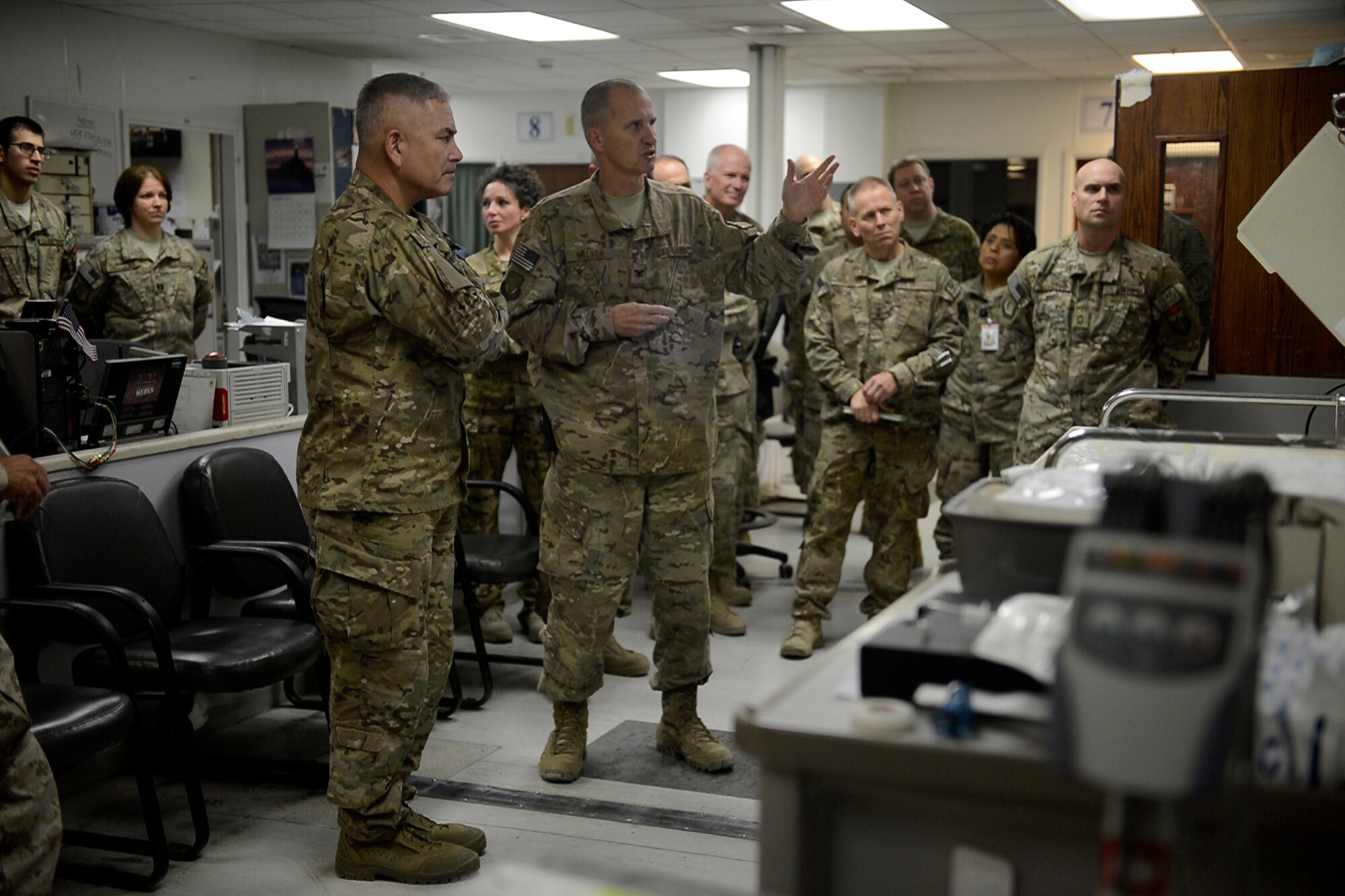 U.S. Air Force Airmen with the 455th Expeditionary Medical Group brief U.S. Army Gen. John Campbell, International Security Assistance Force and United States Forces- Afghanistan commander about the importance of the Joint Craig Theater Hospital at Bagram Airfield, Afghanistan Oct. 12, 2014.  Campbell visited several units and thanked Airmen for their service.  (U.S. Air Force photo by Staff Sgt. Evelyn Chavez/Released)