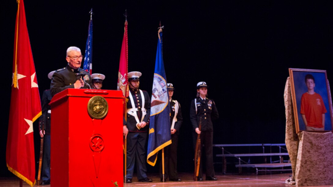 Lt. Gen. John Toolan, Marine Corps Forces, Pacific commander, speaks to more than 100 guests during an honorary Marine ceremony in Jonesville, Virginia on Oct. 15, 2014. Jacob Sprinkle received the title posthumously after a complication with a heart transplant took his life in January.
