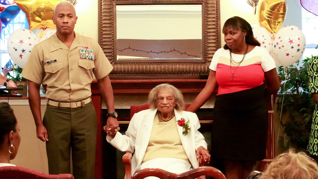 Ella Jackson, a 93-year-old widow, receives a Congressional Gold Medal replica in lieu of her late husband, Master Sgt. George Jackson, in Port Royal, S.C., Oct. 2. George Jackson enlisted in the Marine Corps in 1942 and retired after 27 years of service in 1969. Brigadier General Terry Williams, the first African-American commanding general of Marine Corps Recruit Depot Parris Island, presented Jackson with the medal at a ceremony. In 2012, congress awarded the Montford Point Marines with the Congressional Gold Medal, the United States' highest civilian award bestowed by congress.