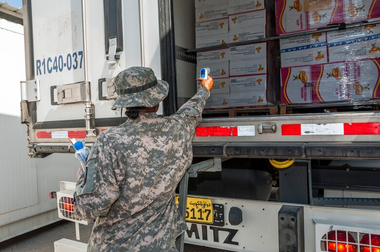 Army Spc. Juanetta Goldwire, 719th Medical Detachment Veterinary Services checks the expiration label on food stored at the rations warehouse at The Rock Aug. 7, 2014. As a food inspector, Goldwire’s primary mission is to reduce the risks to public health associated with diseases and other health hazards in food that is designated for more than 3,000 Airmen, Soldiers, Marines, Sailors and contractors reasons. Goldwire deployed here from the 719th Medical Detachment Veterinarian Service, Fort Sheridan, Illinois. (U.S. Air Force photo by Senior Master Sgt. Allison Day)