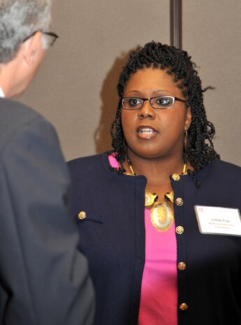 Lillian Fox talks with a potential contractor about the Information Technology Services Program during Huntsville Center's 2014 small business forum.