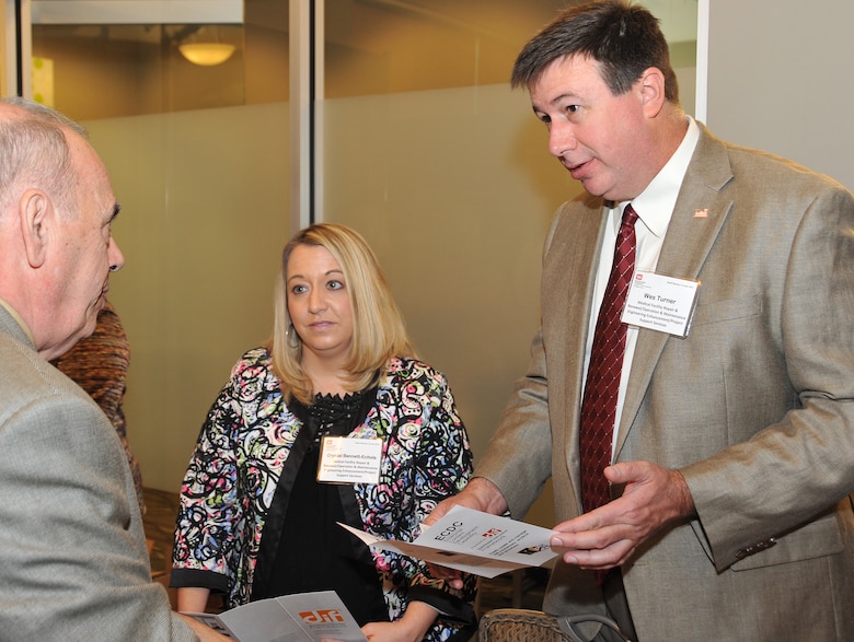 Len Iseldyke from D2Team-Sim discusses his firm's capabilities with Crystal Bennett-Echols and Wes Turner of the Installation Support and Programs Management Directorate's Medical Division programs during the center's Small Business Forum Oct. 15 at Jackson Center in Cummings Research Park.  