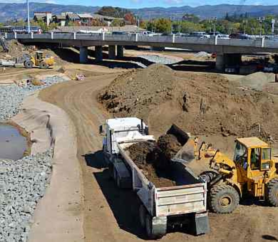 Construction continues on the U.S. Army Corps of Engineers’ dry bypass project in downtown Napa, California. The bypass will shortcut floodwater to avoid a horseshoe-like bend in the river that often backs up and causes flooding into downtown Napa. Construction is scheduled for completion in summer 2015.