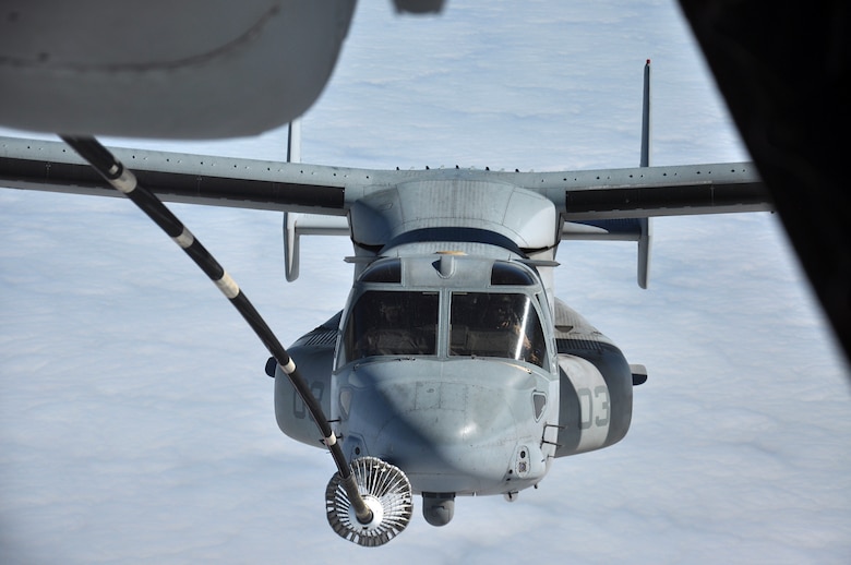 Capt. Chris Ryan and Capt. Chris Montgomery fly their MV-22 Osprey making contact with a KC-10 Extender's drogue from Travis Air Force Base off the coast of San Francisco at 10,000 feet Oct. 12, 2014. This was the first operational training mission for Travis aircrews to refuel an Osprey. The pilots are assigned to the Marine Medium Tiltrotor Squadron 165, Marine Aircraft Group 16, 3rd Marine Aircraft Wing. (U.S. Air Force photo by Staff Sgt. Christopher Carranza)