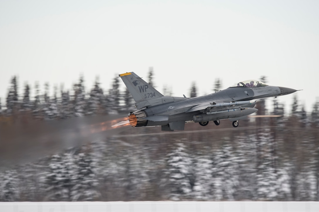 An Air Force F-16 Fighting Falcon assigned to the 35th Fighter Squadron, Kunsan Air Base, South Korea, takes off for a sortie Oct. 6, 2014, at Eielson Air Force Base, Alaska, during Red Flag-Alaska 15-1. RF-A is a series of Pacific Air Forces commander-directed field training exercises for U.S. and partner nation forces, providing combined offensive counter-air, interdiction, close air support and large force employment training in a simulated combat environment. (U.S. Air Force photo/Senior Airman Peter Reft)