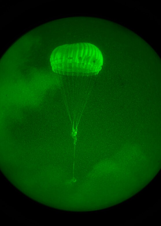 A member from the 736th Security Forces Squadron prepares to land during a static line jump Oct. 8, 2014, on Andersen Air Force Base, Guam. The 736th perform jumps to maintain mission standards. (U.S. Air Force photo/Senior Airman Katrina M. Brisbin)