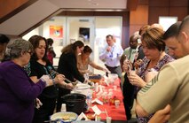 Members of Marine Air Ground Task Force Command, Control and Communications, or MC3, serve food to attendees during a celebration Oct. 15 in Stafford, Virginia. The event, called “Fiesta of Flavors,” was hosted by MC3. It featured a food tasting, trivia competition and Marine Corps veteran and Nicaragua native Donald Calero as the guest speaker.