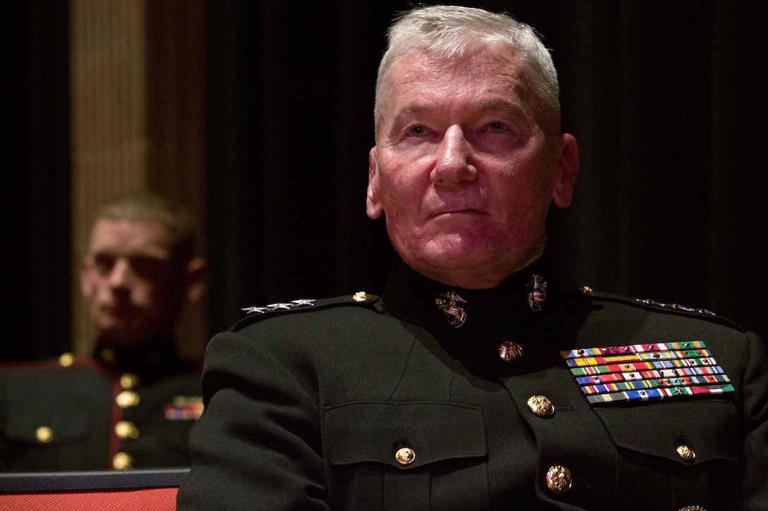 Lt. Gen. John Toolan, Marine Corps Forces, Pacific commander, listens to opening remarks during an honorary Marine ceremony in Jonesville, Virginia, Oct. 15, 2014. Toolan recommended Jacob Sprinkle, a 13-year-old who passed away in January after receiving a heart transplant, for the designation and presented the certificate to Jacob’s family.  