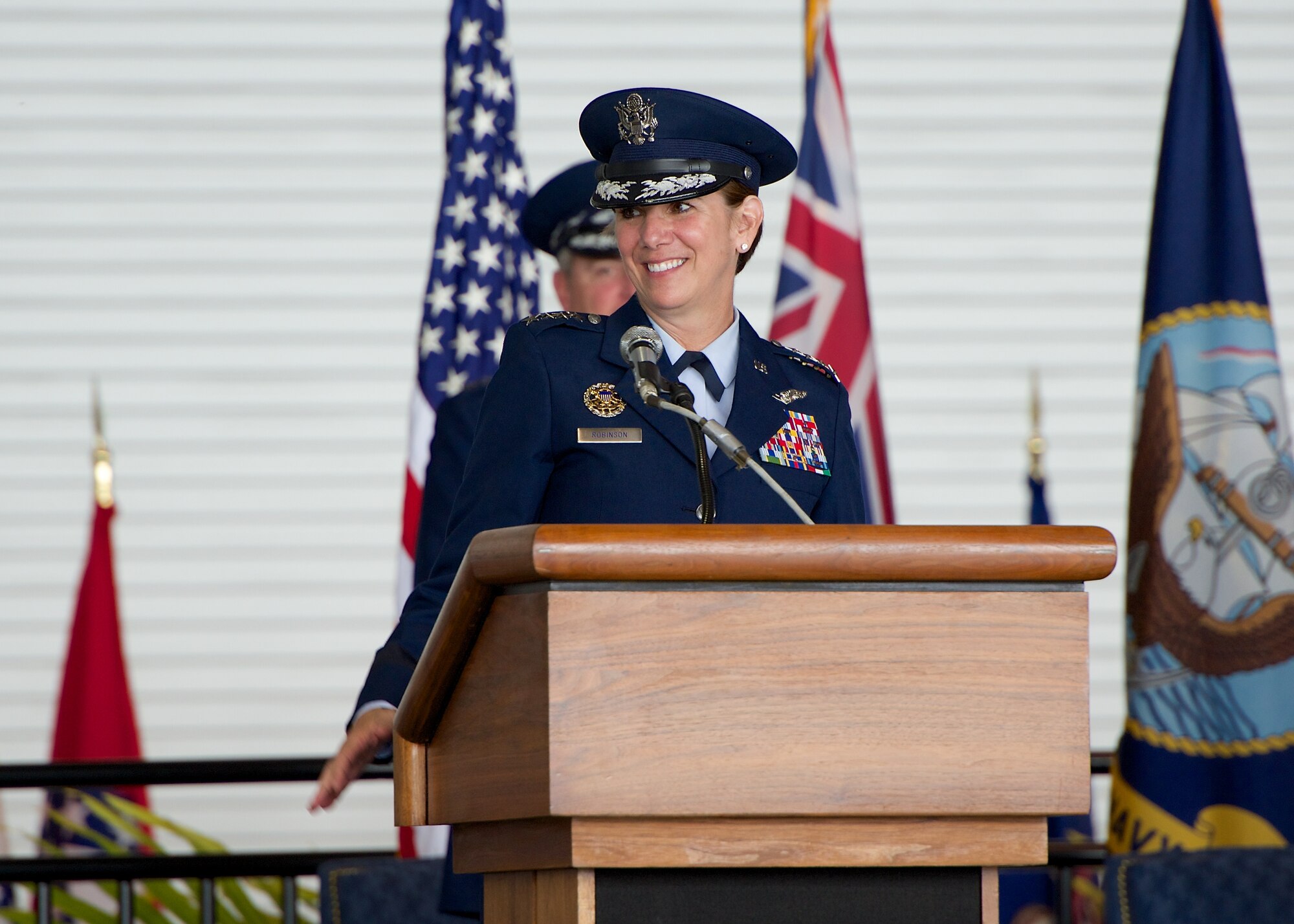 Gen. Lori Robinson, Pacific Air Forces commander, addresses Airmen during the PACAF change of command ceremony at Joint Base Pearl Harbor-Hickam, Hawaii, Oct. 16, 2014. Robinson became the first woman to lead a U.S. Air Force Component Major Command when she succeeded Carlisle during the ceremony. (U.S. Air Force photo by Capt. Raymond Geoffroy/Released)
