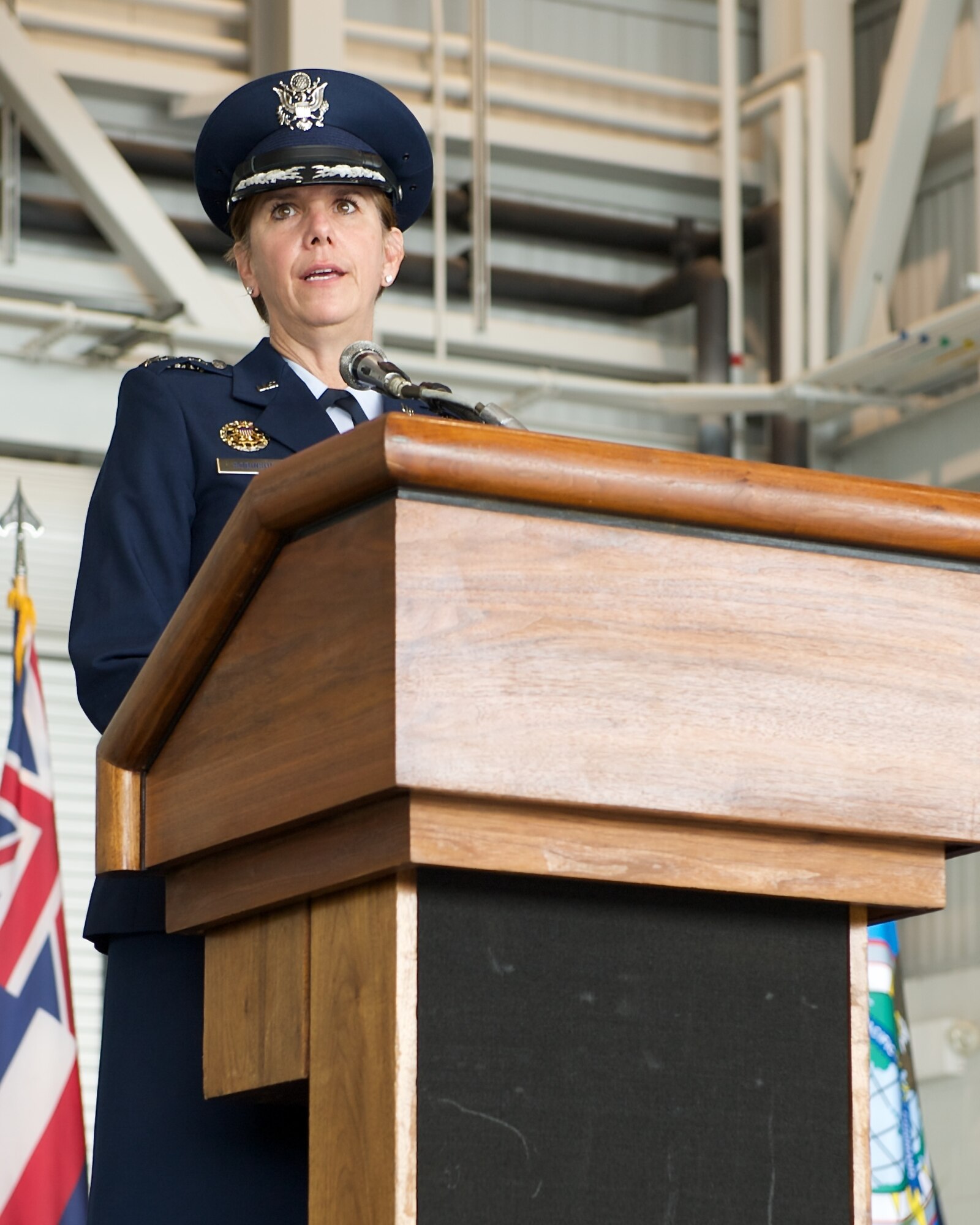 Gen. Lori Robinson, Pacific Air Forces commander, addresses Airmen during the PACAF change of command ceremony at Joint Base Pearl Harbor-Hickam, Hawaii, Oct. 16, 2014. Robinson became the first woman to lead a U.S. Air Force Component Major Command when she succeeded Carlisle during the ceremony. (U.S. Air Force photo by Tech. Sgt. James Stewart/Released)