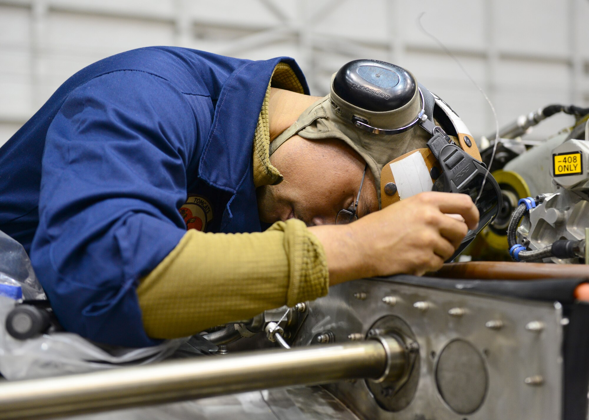 U.S. Marine Corps Sgt. David Delgado, a Marine Attack Squadron 311 power line mechanic, assigned to Marine Corps Air Station Yuma, Ariz., performs maintenance on an engine Oct. 2, 2014, during RED FLAG-Alaska 15-1 at Eielson Air Force Base, Alaska. RF-A is a series of Pacific Air Forces commander-directed field training exercises for U.S. and partner nation forces, providing combined offensive counter-air, interdiction, close air support and large force employment training in a simulated combat environment. (U.S. Air Force photo by Senior Airman Ashley Nicole Taylor/Released)