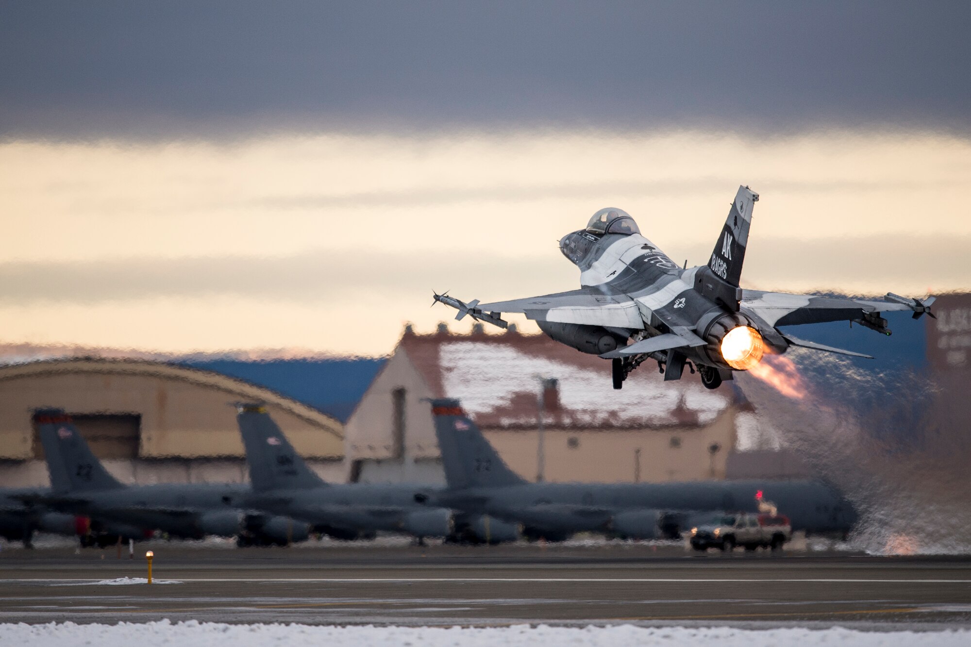 A U.S. Air Force F-16 Fighting Falcon fighter aircraft assigned to the 18th Aggressor Squadron takes off for a sortie from Eielson Air Force Base, Alaska, Oct. 15, 2014, during RED FLAG-Alaska 15-1. RF-A is a series of Pacific Air Forces commander-directed field training exercises for U.S. and partner nation forces, providing combined offensive counter-air, interdiction, close air support and large force employment training in a simulated combat environment. (U.S. Air Force photo by Senior Airman Peter Reft/Released)