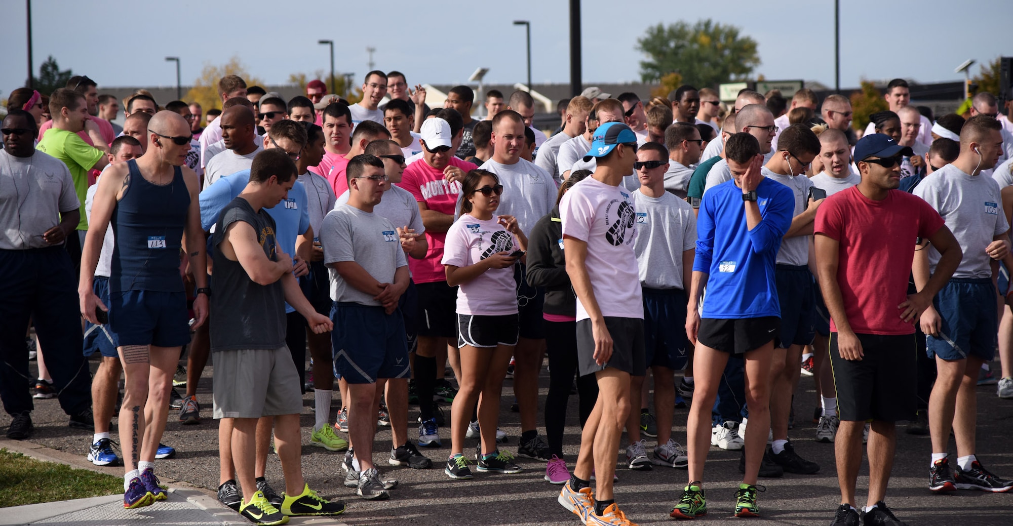 Runners wait at the starting line for the start of the 2nd Annual Breast Cancer Awareness Month 5K walk/run at Malmstrom Air Force Base, Mont., Oct. 15.  Nearly 200 runners and walkers participated in the 5K to show support for those who are dealing with breast cancer, as well as family members of loved ones who have lost their battle with this disease. (U.S. Air Force photo/ Airman 1st Class Joshua Smoot)