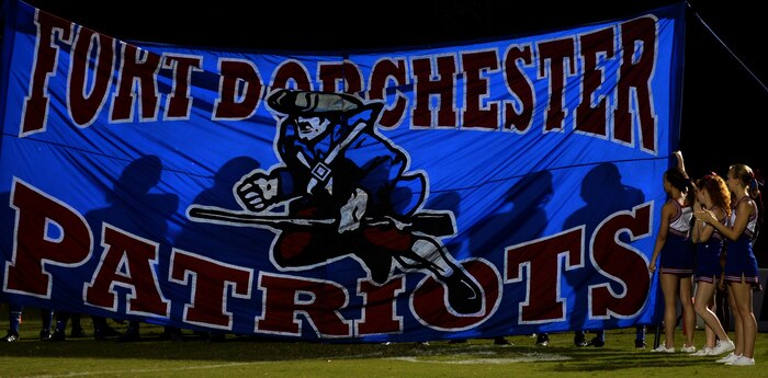 Players from Fort Dorchester High School Patriots prepare to take the field against the Wando High School Warriors Sept. 26, 2014, at Wando High School, Charleston, S.C. The Patriots beat the Warriors 24-0 bringing their record to 5-1. (U.S. Air Force photo by Senior Airman Daniel Hughes)