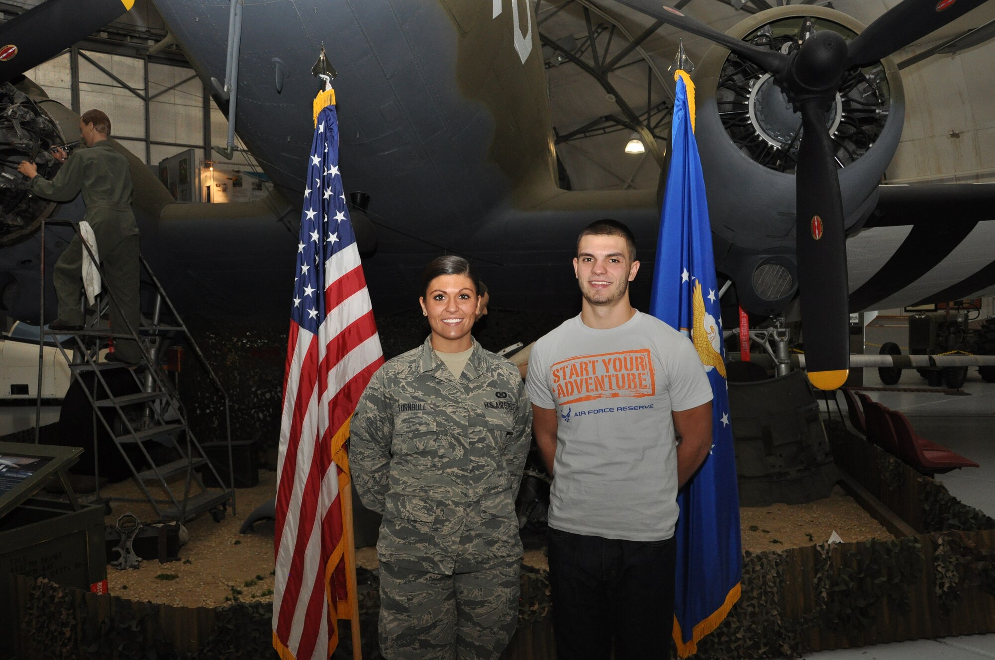 Airman Sierra Turnbull, 512th Operations Support Squadron, stands with her brother Justin Turnbull following a mass enlistment ceremony Oct. 4, 2014, at the Air Mobility Command Museum, Dover, Del., where Justin took the oath of enlistment to serve in the Air Force Reserve's 512th Maintenance Squadron as an avionics test station and components specialist. (U.S. Air Force photo/Senior Airman Joe Yanik)