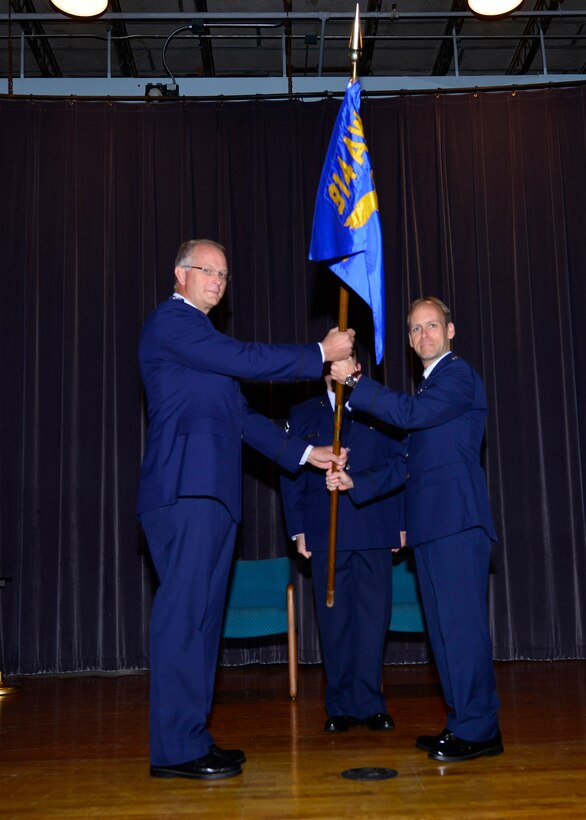Lt. Col. Joseph D. Janik (right) assumes command of the 914th Operations Group at the Niagara Falls Air Reserve Station, Oct. 4, 2014. Prior to commanding the 914th Operations Group, Janik served around the world as an enlisted Airman and commissioned officer in numerous duties. He previously served at NFARS in 1992 with the 328th Airlift Squadron as a C-130 Flight Engineer. After commissioning, he served here in various capacities as a C-130 pilot and as chief of standards and evaluations. Before assuming command of the 914th Operations Group he was the 327th Airlift Squadron Commander, Little Rock Little Rock AFB, AR. (U.S. Air Force photo by Staff Sgt. Stephanie Sawyer)