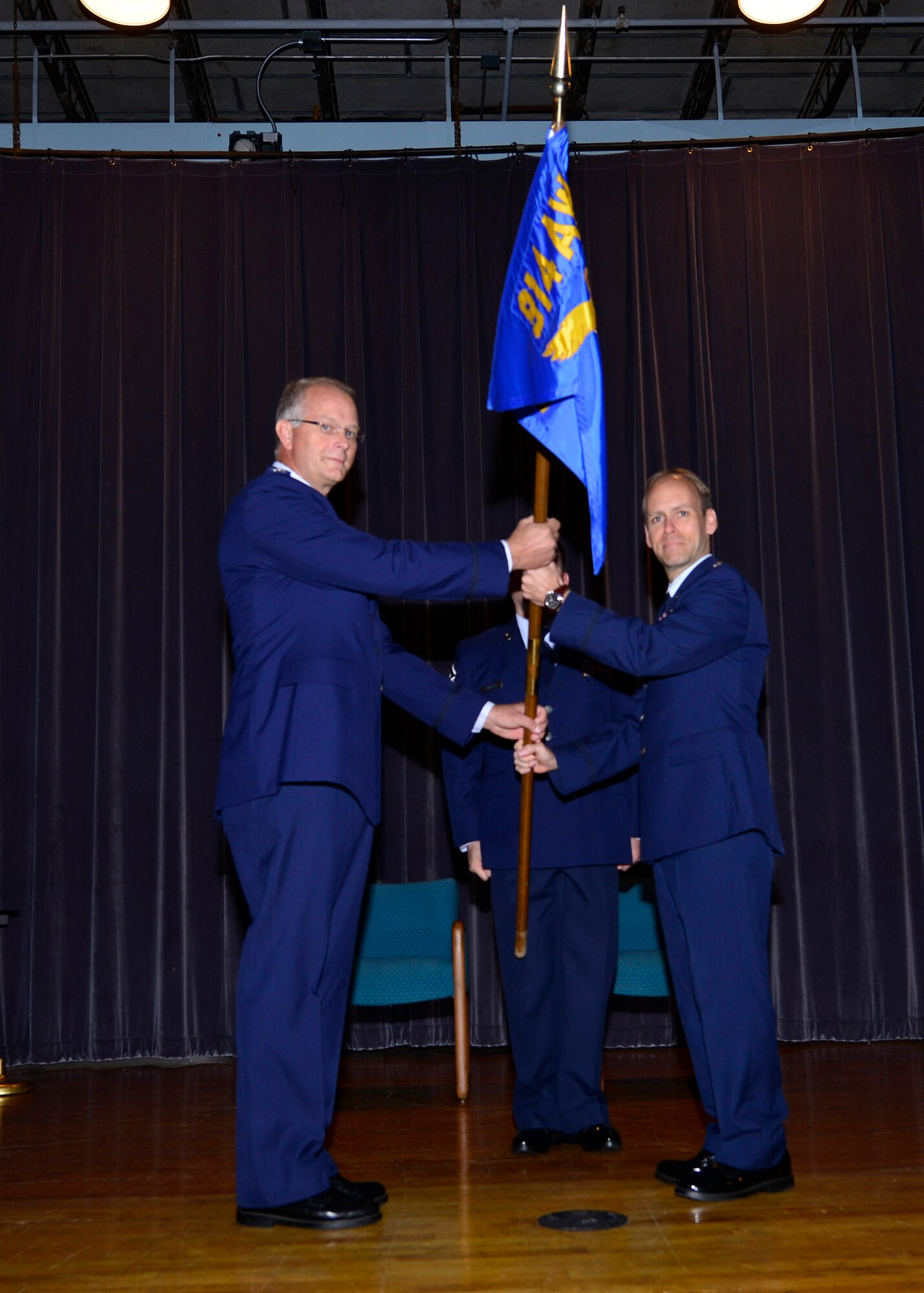Lt. Col. Joseph D. Janik (right) assumes command of the 914th Operations Group at the Niagara Falls Air Reserve Station, Oct. 4, 2014. Prior to commanding the 914th Operations Group, Janik served around the world as an enlisted Airman and commissioned officer in numerous duties. He previously served at NFARS in 1992 with the 328th Airlift Squadron as a C-130 Flight Engineer. After commissioning, he served here in various capacities as a C-130 pilot and as chief of standards and evaluations. Before assuming command of the 914th Operations Group he was the 327th Airlift Squadron Commander, Little Rock Little Rock AFB, AR. (U.S. Air Force photo by Staff Sgt. Stephanie Sawyer)