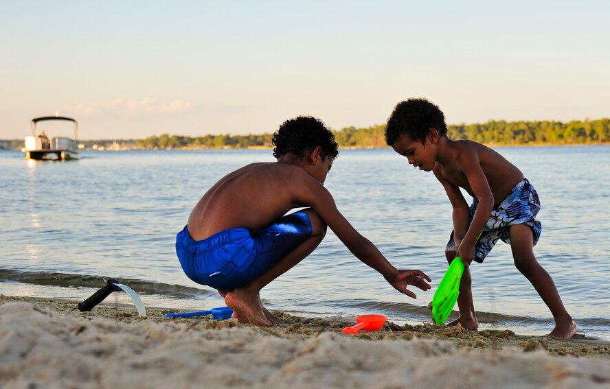 Braylon Harvey, 8, and Delasi Dogbe, 3, dig in the sand at Eglin’s Post’l Point during an event hosted by the base Exceptional Family Member Program Oct. 11. Registered program families, who attended the event, played beach games, took boat rides, made arts and crafts and watched a movie on a big outdoor screen. EFMP provides services for military members who have at least one family member with ongoing medical, behavioral health, or special educational needs. To learn more about EFMP or to register a family, contact Airman and Family Readiness at (850) 882-9060. (U.S. Air Force photo/Chrissy Cuttita)