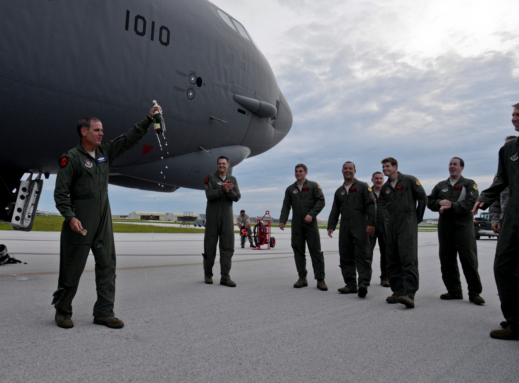U.S. Air Force Lt. Col. Steve Smith, 93rd Bomb Squadron from Barksdale Air Force Base, La., B-52 Stratofortress radar navigator, celebrates reaching 9,000 flying-hours, Oct. 8, 2014, at Andersen Air Force Base, Guam. Smith currently has the most flying hours in a B-52H; the next aviator is 2,000 hours behind him. (U.S. Air Force photo by Staff Sgt. Robert Hicks/Released)