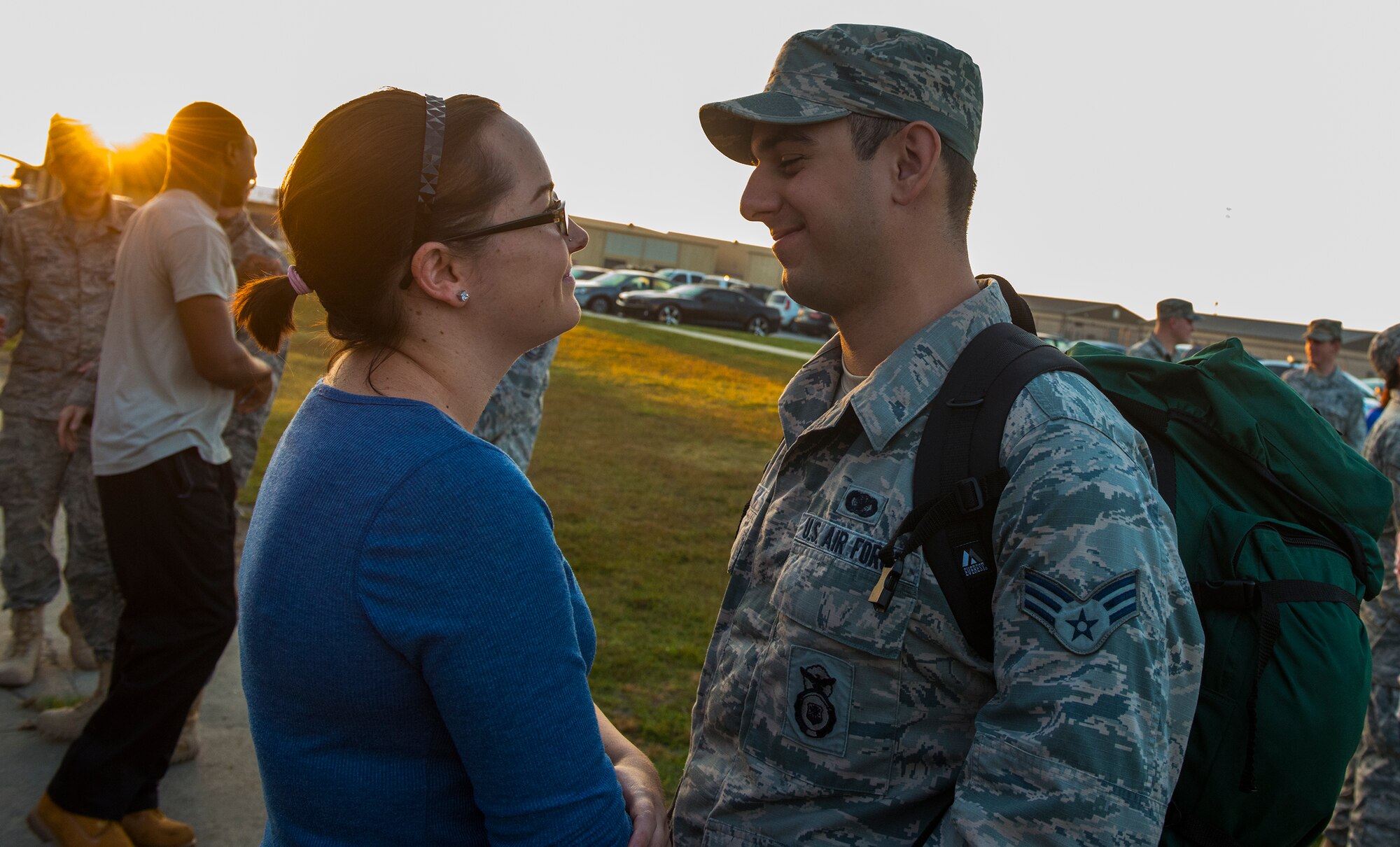U.S. Air Force Senior Airman Nicholas Koch, 822d Base Defense Squadron fire team member  and his wife Rachel take a final gaze before his deployment Oct. 12, 2014, at Moody Air Force Base, Ga. Approximately 165 Airmen left Moody for a six-month deployment to Southwest Asia. (U.S. Air Force photo by Airman 1st Class Ceaira Tinsley/Released)