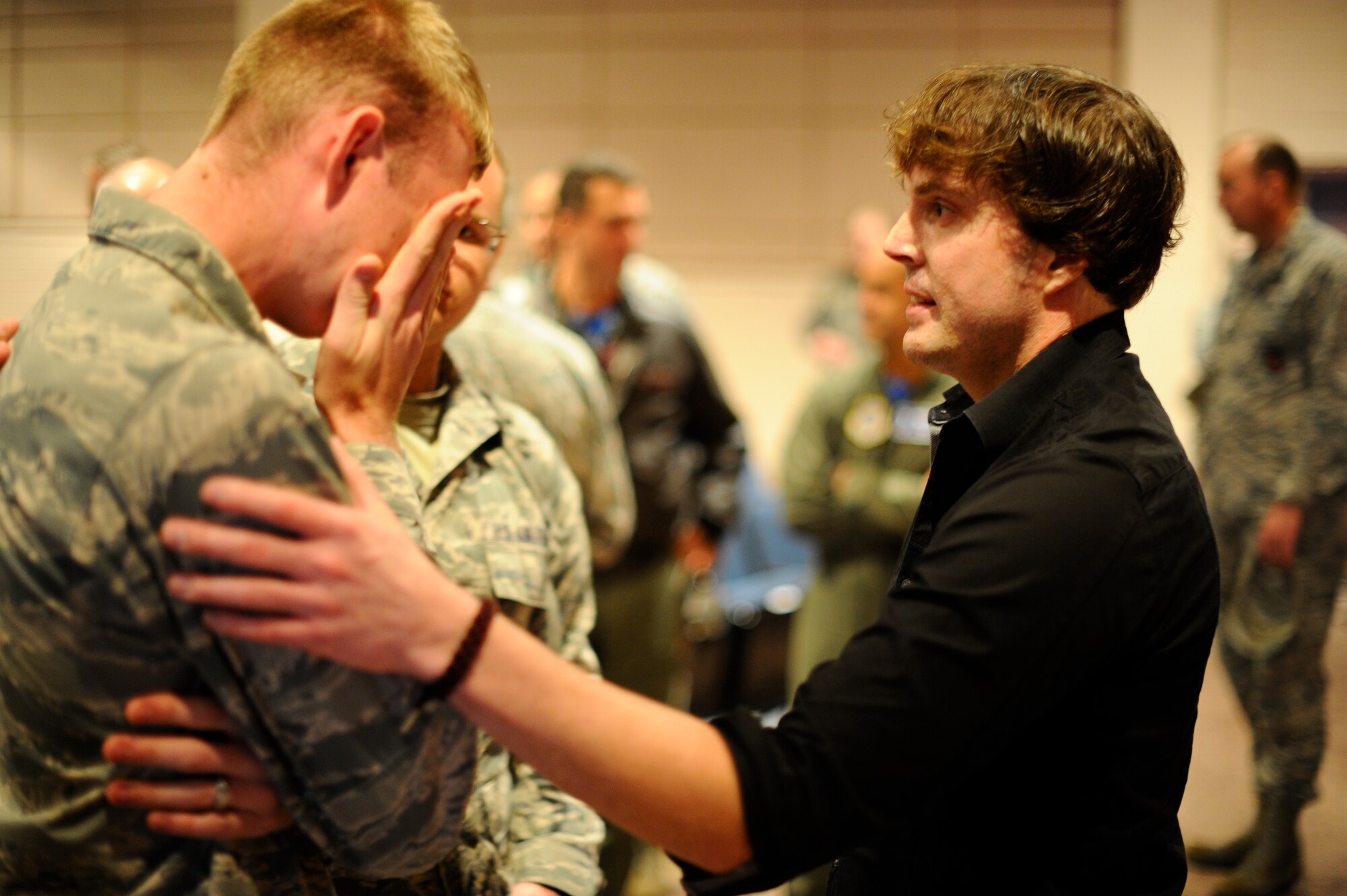 Jared Estes, survivor of an alcohol related car crash, speaks to an Airman who also lost a family member from an intoxicated driver, Oct. 10, 2014, at McConnell Air Force Base, Kan. Estes spent nearly a decade recovering from the wounds of a car crash and the death of his wife. He shared his story of recovery to the members of Team McConnell. (U.S. Air Force photo/Airman 1st Class John Linzmeier)