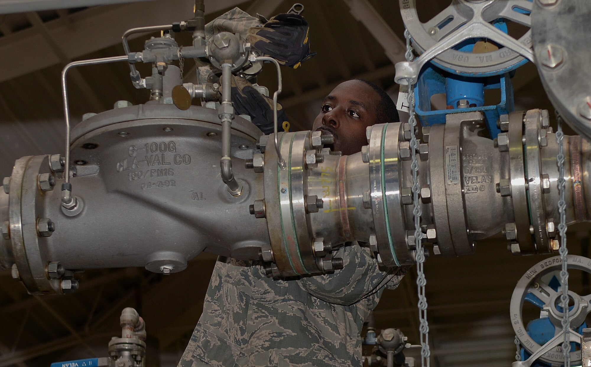 Airman 1st Class Jason Singleton, 22nd Civil Engineer Squadron water and fuel systems maintenance apprentice, checks the flow rate on a control valve Sept. 30, 2014, at McConnell Air Force Base, Kan. This is a procedure that must be performed semi-annually to ensure that the correct amount of fuel is getting pushed into the fuel separator. (U.S. Air Force photo/Airman 1st Class Colby L. Hardin)