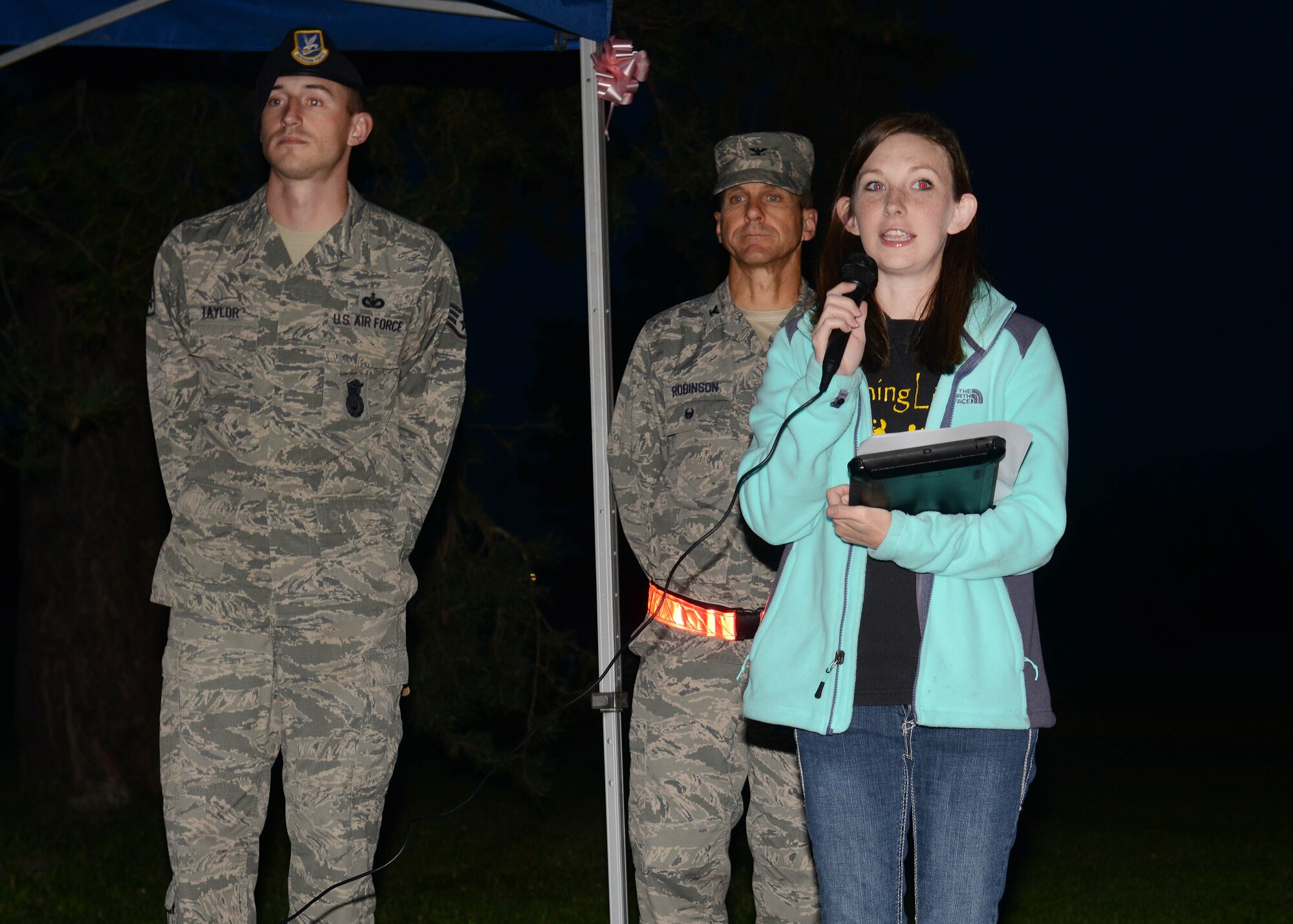 Tabitha Ryan, wife of Senior Airman Jordan Ryan, 31st Maintenance Squadron, shares a personal story during a Sudden Infant Death Syndrome awareness 5K, Oct. 15, 2014, at Aviano Air Base, Italy. SIDS is the leading cause of death for infants between one month and one year old in the U.S. (U.S. Air Force photo/Airman 1st Class Deana Heitzman)    