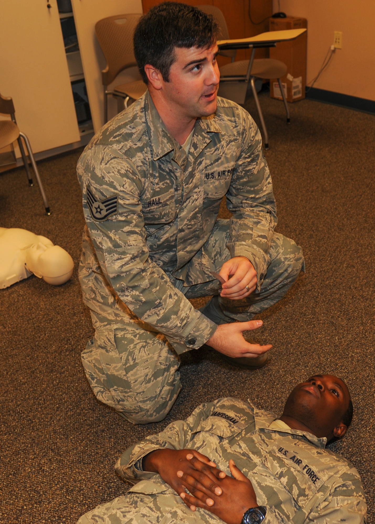 Staff Sgt. Ryan Hall, 19th Medical Group education and training noncommissioned officer in charge, prepares to use a nasopharyngeal airway tube on Senior Airman Deven Domingue, a 19th Medical Operations Squadron family health medical technician, Sept. 9, 2014, at Little Rock Air Force Base, Ark. Using an NPA is a vital part of airway management and is taught during the Self-Aid and Buddy Care class.  (U.S. Air Force photo by Airman 1st Class Harry Brexel)