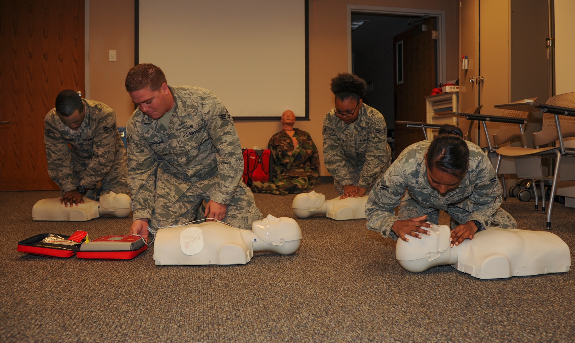 Airmen practice cardiopulmonary resuscitation on training mannequins as part of an airway management class Sept. 9, 2014, at Little Rock Air Force Base, Ark.  Airmen can obtain their CPR certification on base at no cost. (U.S. Air Force photo by Airman 1st Class Harry Brexel)