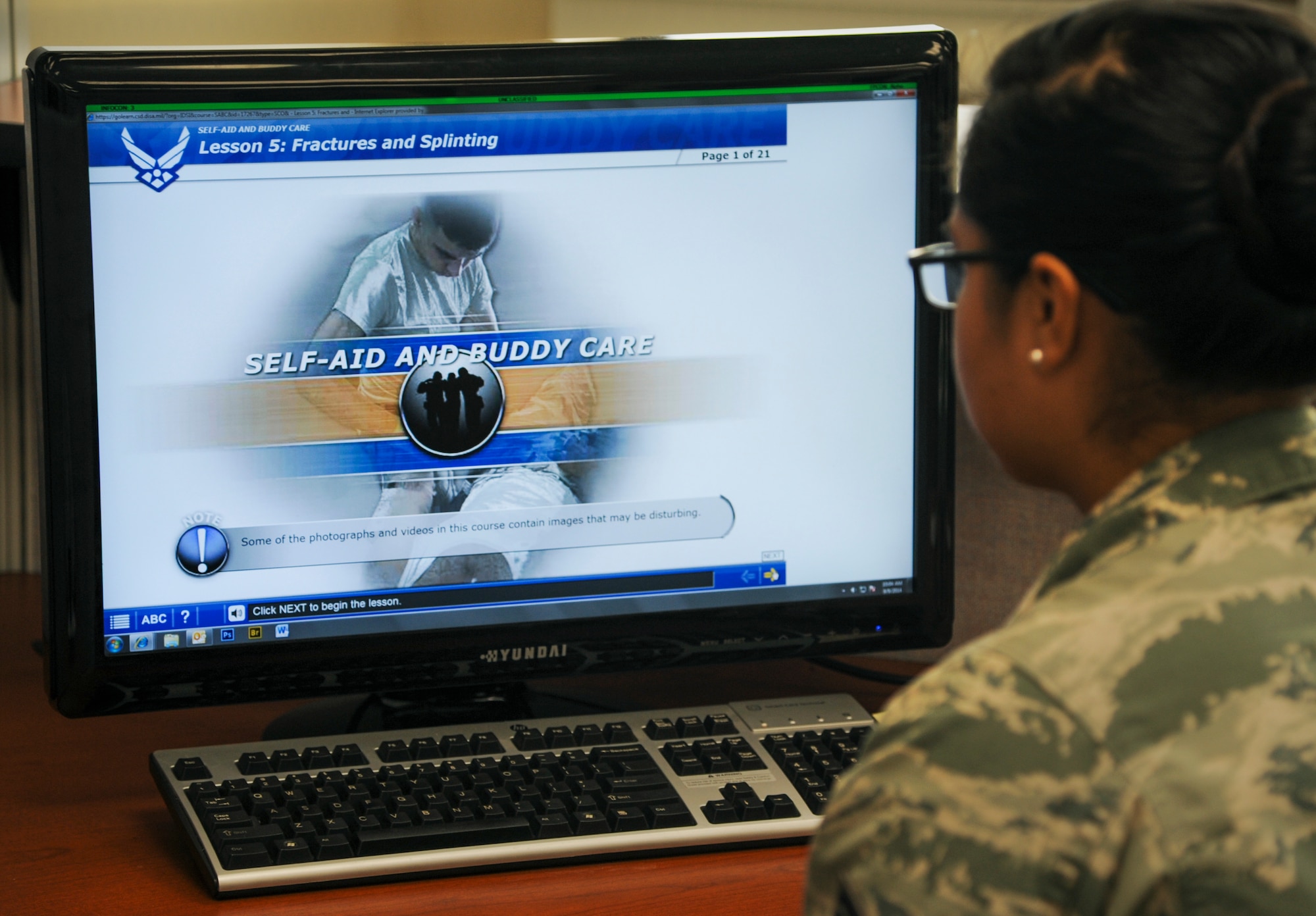 An Airman reads a lesson on Self-Aid and Buddy Care as part of a computer-based training course Sept. 9, 2014, at Little Rock Air Force Base, Ark. SABC involves hands-on training and a CBT course that covers a variety of life-saving techniques. (U.S. Air Force photo by Airman 1st Class Harry Brexel) 