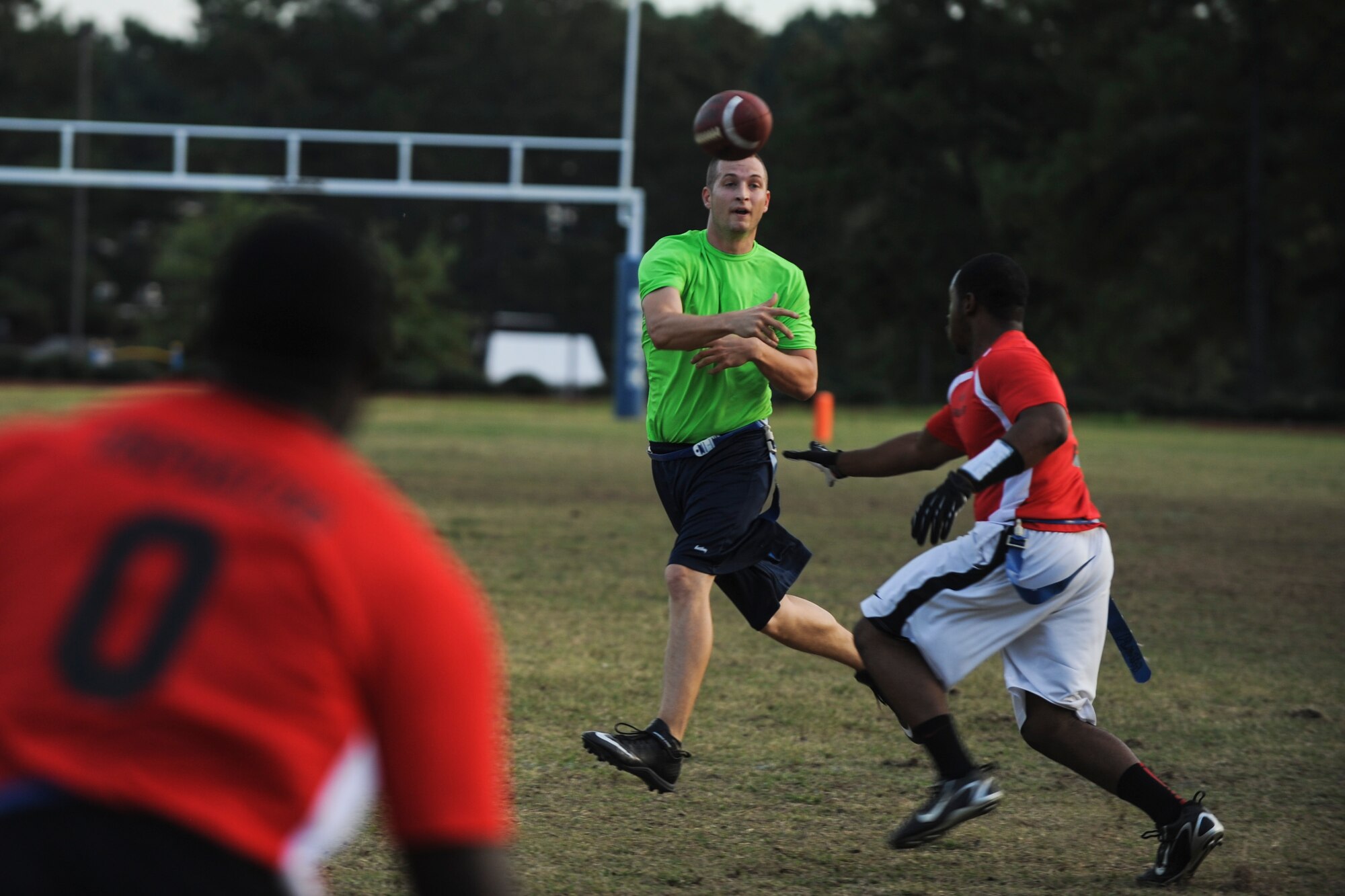 Staff Sgt. Bryan Wails, quarterback for the 19th Logistic Readiness Squadron attempts a pass late in the second half during an intramural flag football game Oct. 9, 2014, at Little Rock Air Force Base, Ark. Wails went six for six on this drive before taking a commanding 19-0 lead into the first half. (U.S. Air Force photo by Airman 1st Class Cliffton Dolezal)