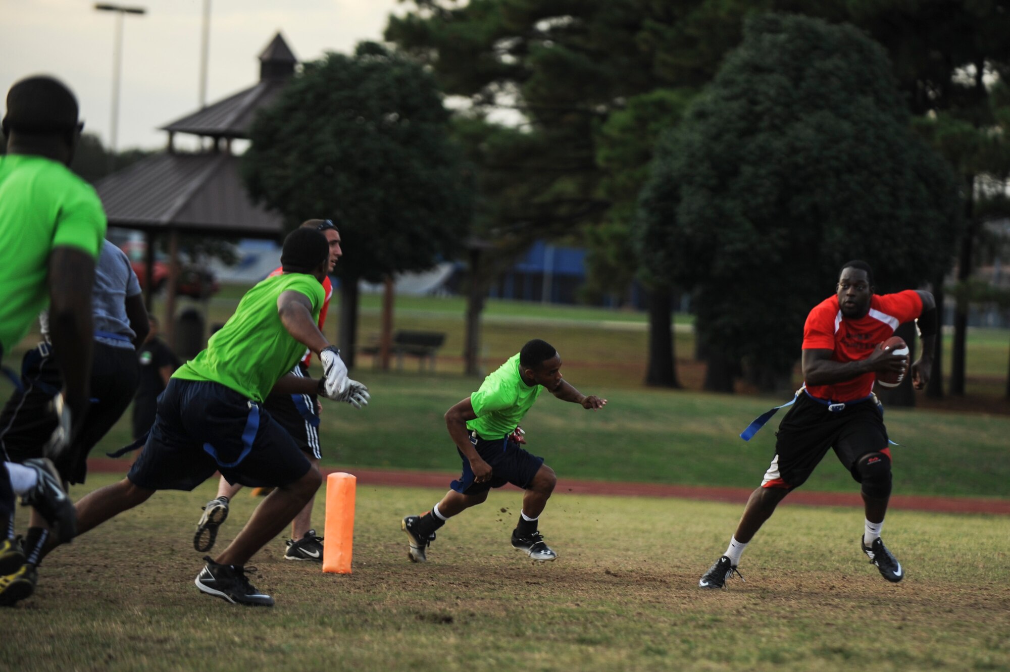 Senior Airman Ernest Opoku quarterback for the 19th Civil Engineer Squadron, scrambles out of the pocket during an intramural flag football game Oct. 9, 2014, at Little Rock Air Force Base, Ark. The 19th CES went on to lose 19-6. (U.S. Air Force photo by Airman 1st Class Cliffton Dolezal)