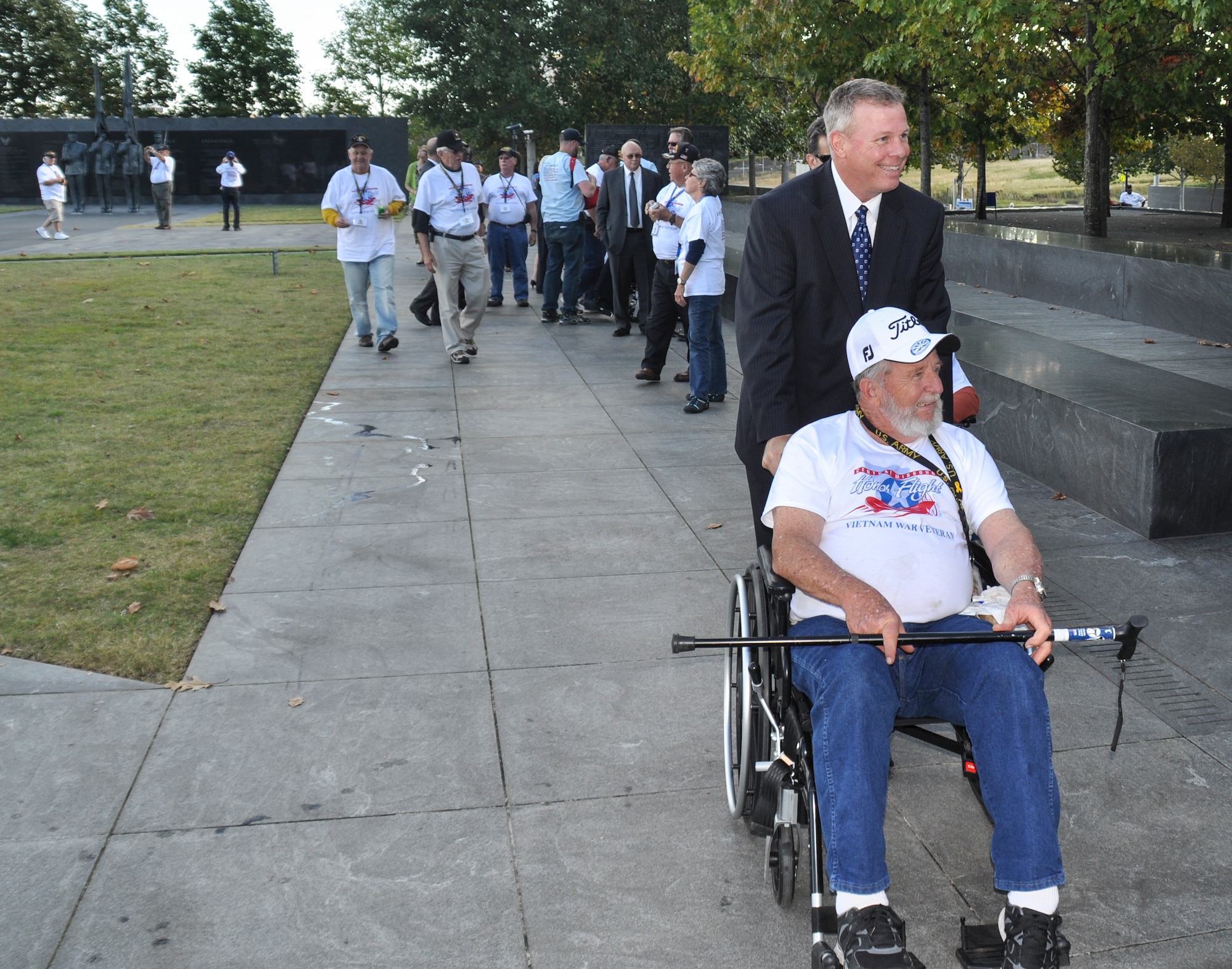 Jay Chesshir, Little Rock Chamber of Commerce president escorts a Vietnam War veteran to the Air Force Memorial Oct. 8, 2014, in Arlington, Virginia. Chesshir visited the memorial to witness the 19th Airlift Wing receive the Doolittle Award.  (U.S. Air Force photo by 1st Lt. Amanda Porter)