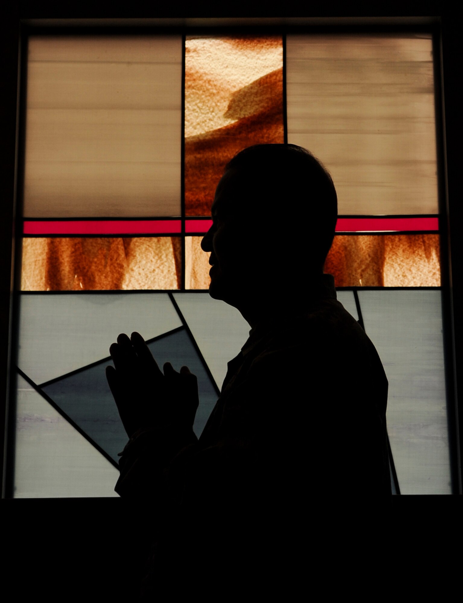 Maj. Elbert Fadallan, 19th Airlift Wing deputy wing chaplain, prays at the chapel Oct. 8, 2014, at Little Rock Air Force Base, Ark. Chaplains provide religious accommodations for a variety of faiths. (U.S. Air Force photo by Airman 1st Class Harry Brexel) 