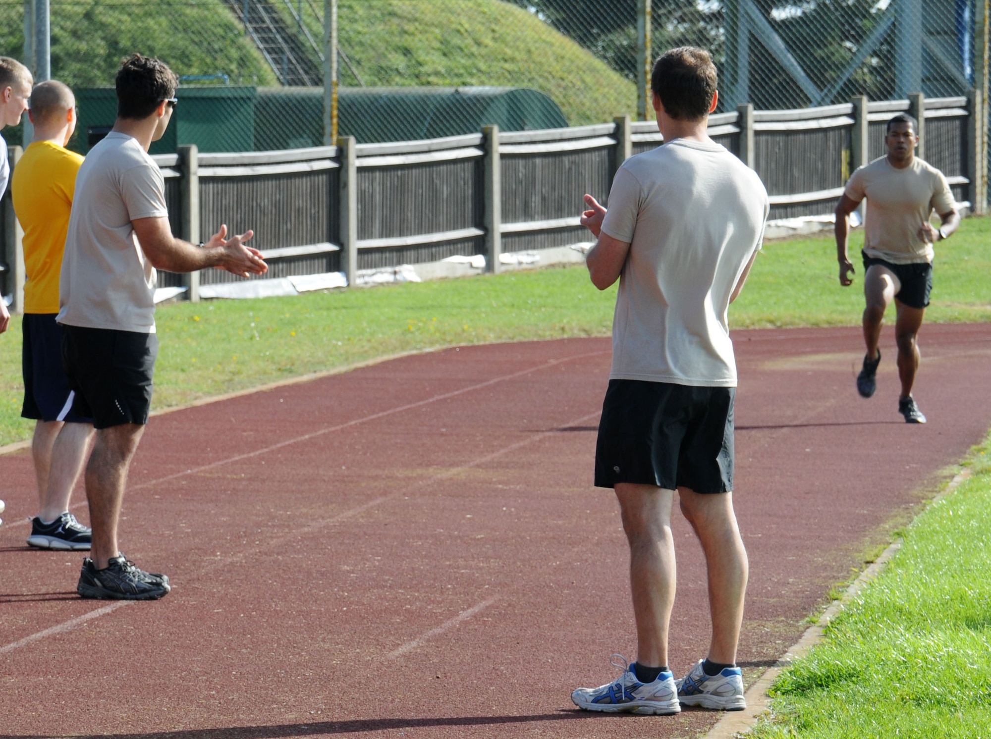 U.S. Air Force members assigned to RAF Mildenhall and RAF Lakenheath take part in a relay race during a Combined Federal Campaign Fitness Challenge Oct. 9, 2014, at Heritage Park on RAF Mildenhall, England. The winning team, "Team Beast Mode” was made up of U.S. Air Force Capt. Jethro Sadorra, 352nd Special Operations Group civil engineer from Monterey, Calif.; U.S. Air Force 1st Lt. Robert Allen, 351st Air Refueling Squadron KC-135 Stratotanker pilot from Newport, N.C.; U.S. Air Force Staff Sgt. Yazmin Shaw, 352nd SOG executive assistant to the command chief from Rochester, N.Y.; and U.S. Air Force Senior Airman Addie Minnis, 100th Communications Squadron communication security accountant, and had a winning time of 28:28. (U.S. Air Force photo/Gina Randall/Released)