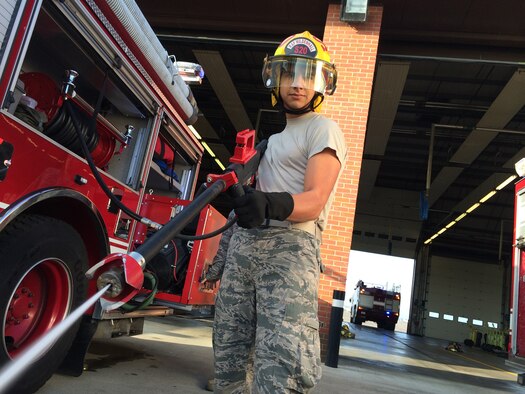 U.S. Air Force Airman 1st Class Jacob Sandoval, 100th Civil Engineer Squadron fire protection journeyman from Pleasanton, Texas, trains with a high-pressure hose Sept. 10, 2014, at the fire department on RAF Mildenhall, England. Firefighters spend a substantial amount of time training every shift to ensure they know where equipment is located on the truck and how to effectively use it. (Courtesy photo/Released)
