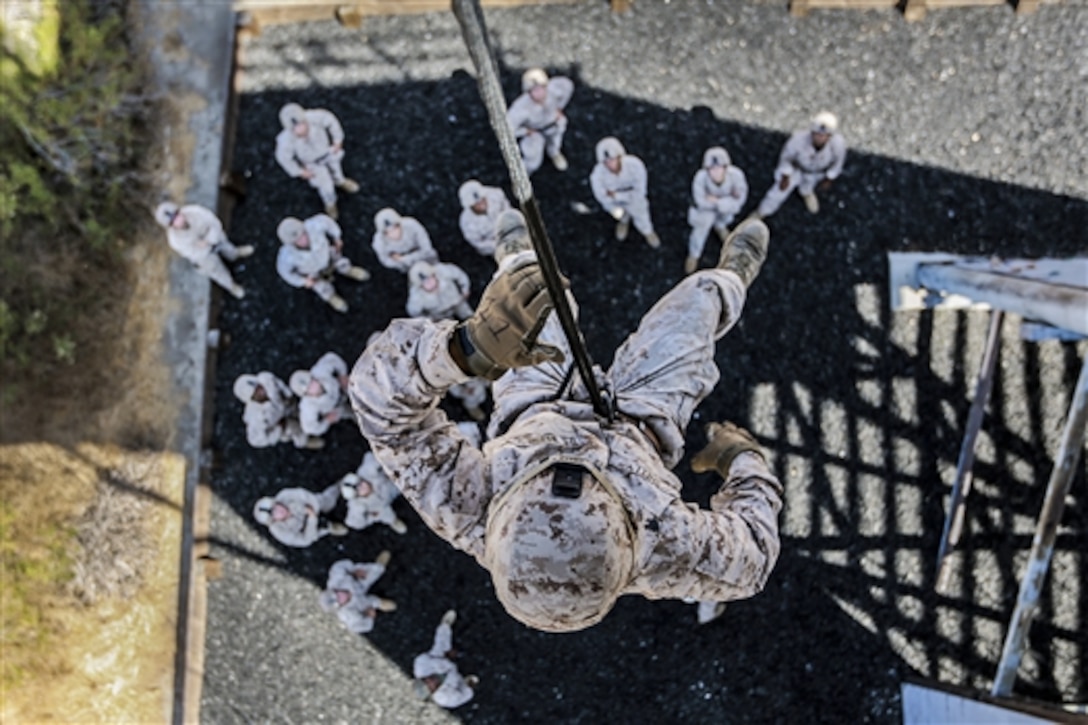 Marine Sgt. Andrew Shelly rappels from a tower during training at Camp Pendleton, Calif., Oct. 14, 2014. Shelly is a machine gunner assigned to 3rd Battalion, 1st Marine Regiment, 15th Marine Expeditionary Unit, who is completing a rope-suspension techniques masters course.