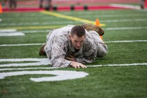 Colonel Scott Creed, Operations Officer for the Futures Directorate, commits to the High Crawl during the annual Combat Fitness Test.