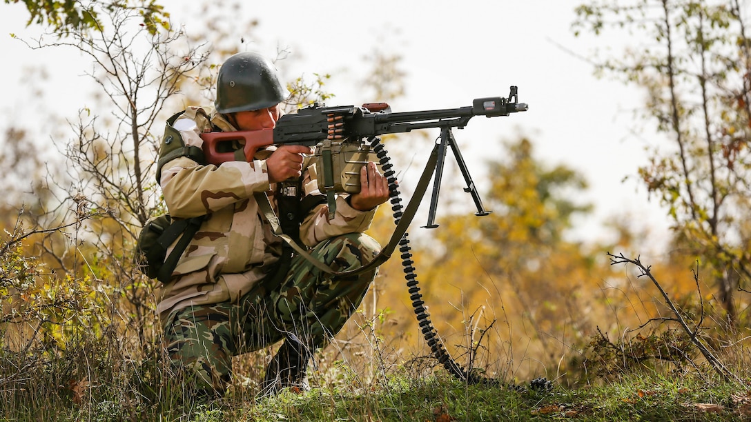 A Bulgarian soldier repels an enemy attack during Exercise Strike Back, Oct. 15 at the Koren Field Training Ground, Bulgaria. Strike Back is a multilateral combat exercise designed to prepare Bulgarian forces to control, command and operate with joint-nation forces. The training consisted of defensive tactics and offensive objectives and maneuvers.