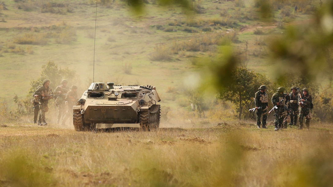 After locating and destroying the enemy's primary defense location, U.S. and Bulgarian forces depart from the battle zone during Exercise Strike Back, Oct. 15 at the Koren Field Training Ground, Bulgaria. Strike Back is a multilateral combat exercise designed to prepare Bulgarian forces to control, command and operate with joint-nation forces. The training consisted of defensive tactics and offensive objectives and maneuvers.